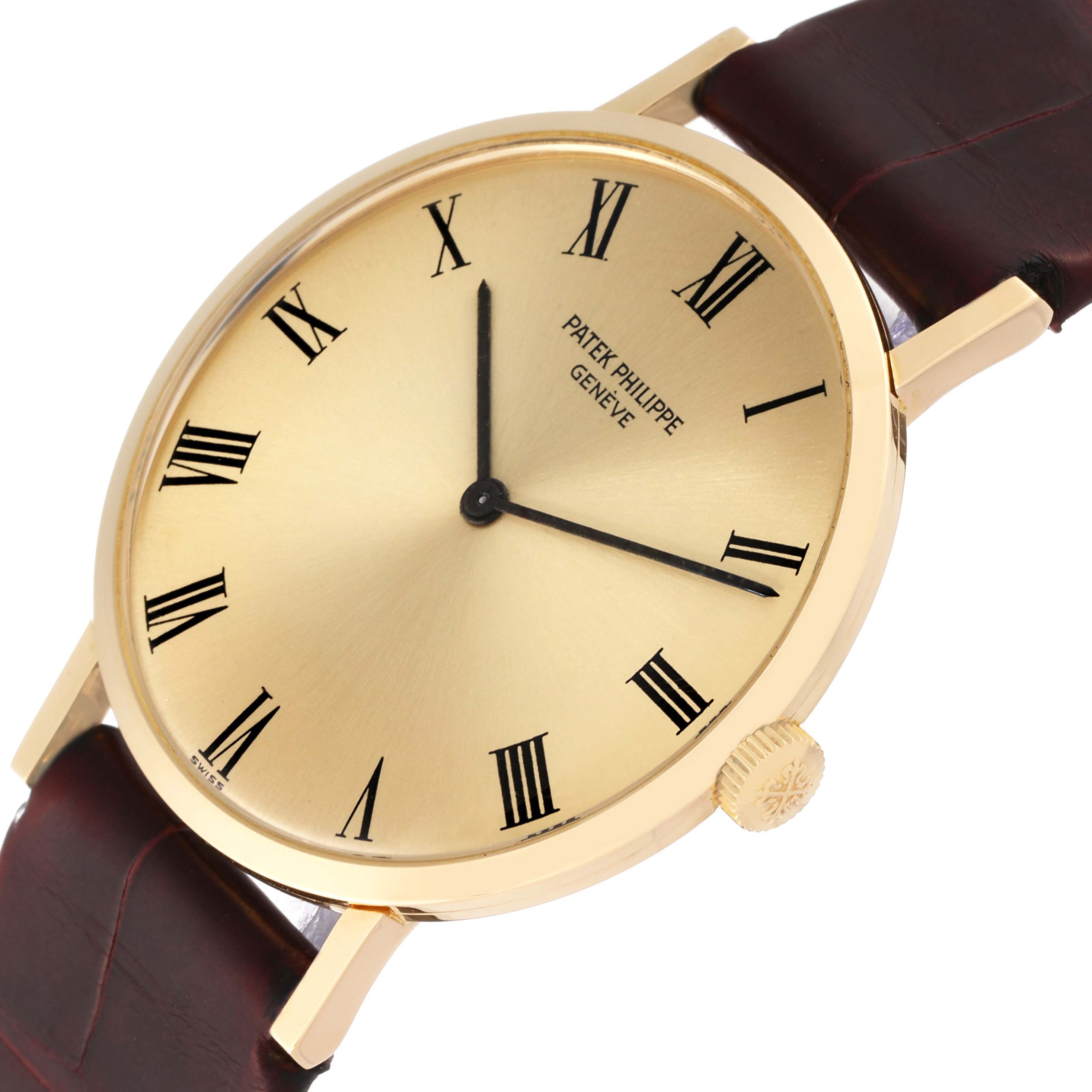 This image shows a close-up angled view of a Patek Philippe Calatrava 3537 Men
s Yellow Gold Champagne Dial 3537 Men
s Yellow Gold Champagne Dial watch, displaying the dial, hands, case, and strap.
