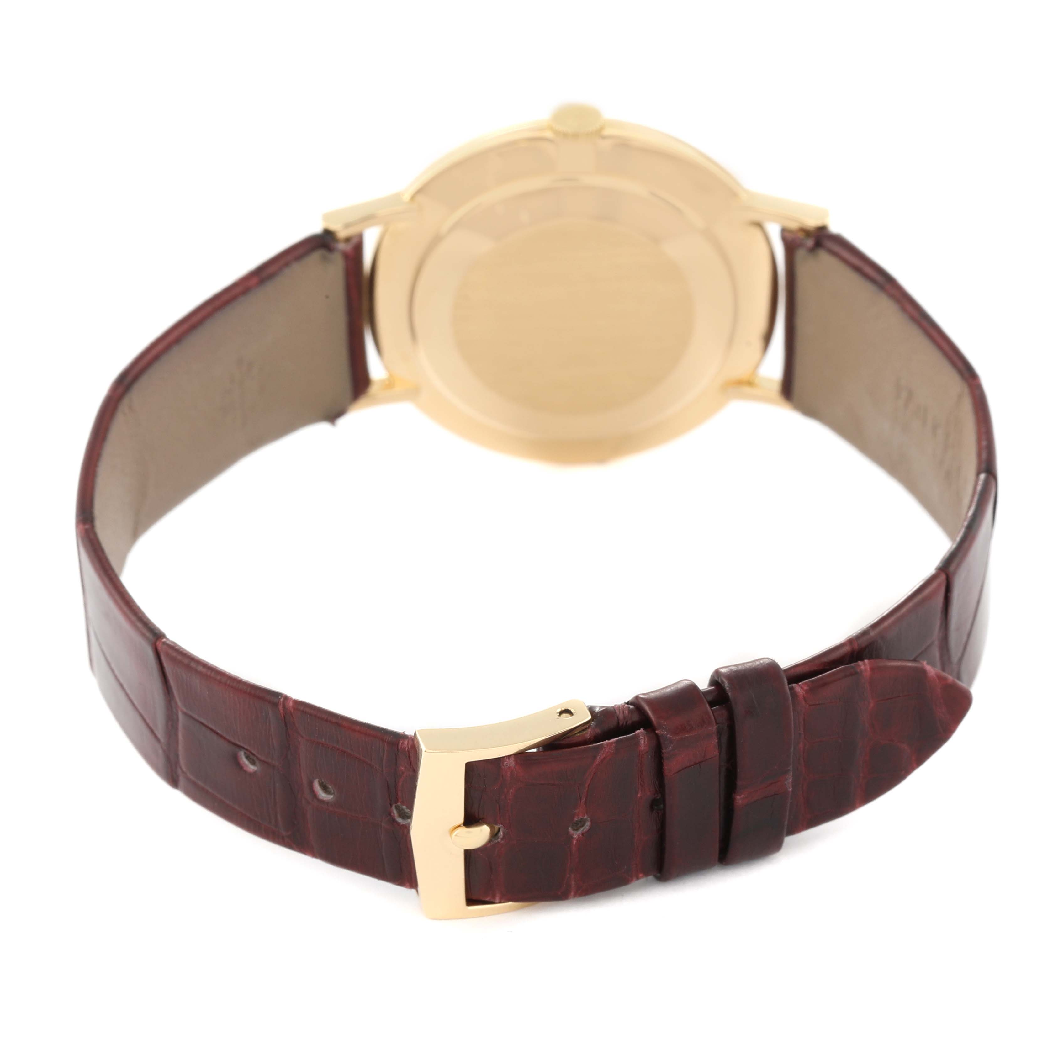 This image shows the back side and buckle of a Patek Philippe Calatrava 3537 Men
s Yellow Gold Champagne Dial 3537 Men
s Yellow Gold Champagne Dial watch with a leather strap.