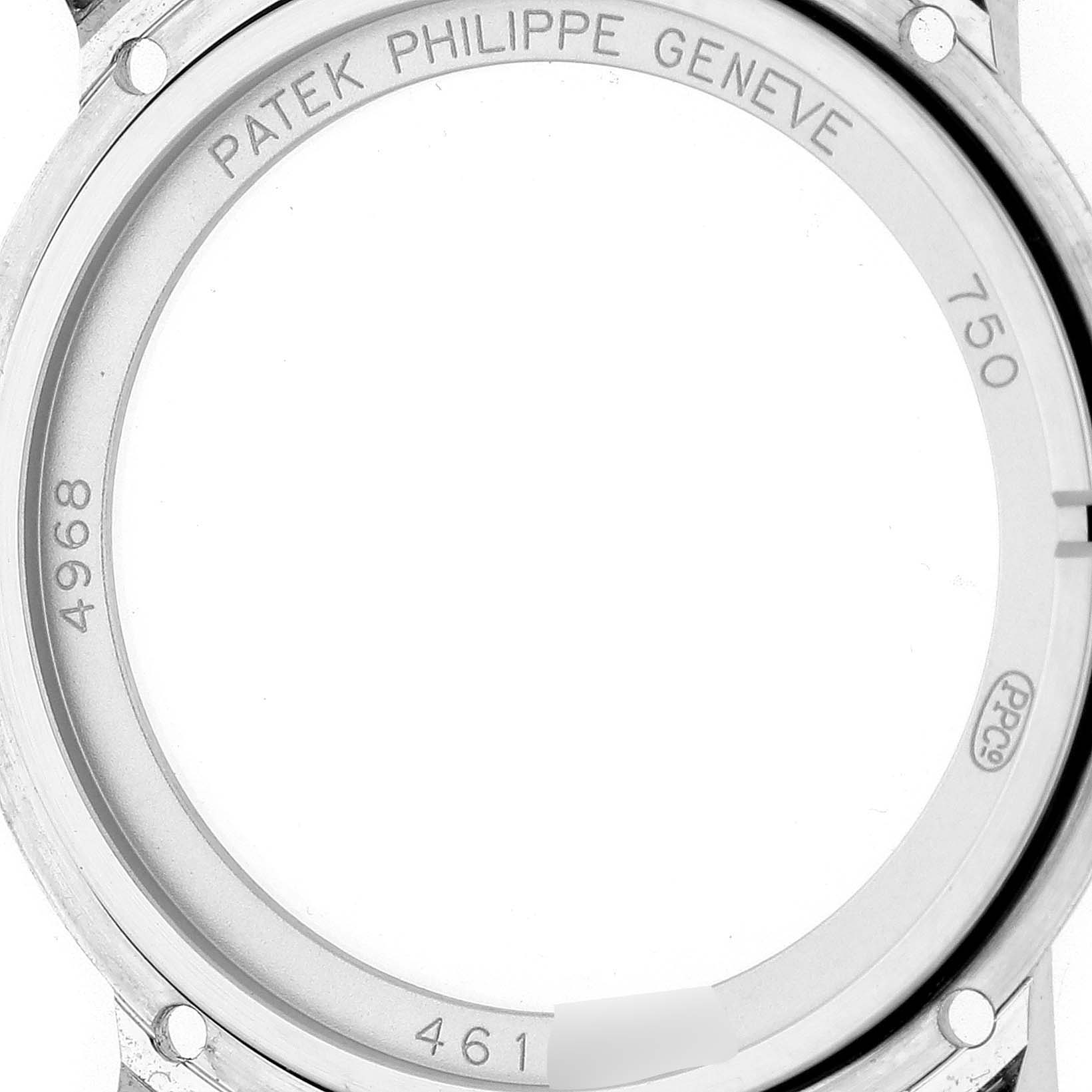 This image shows the back casing of the Patek Philippe Complications 4968G-001 Women's White Gold Mother of Pearl Dial 4968G-001 Women's White Gold Mother of Pearl Dial watch, highlighting engravings and serial numbers.