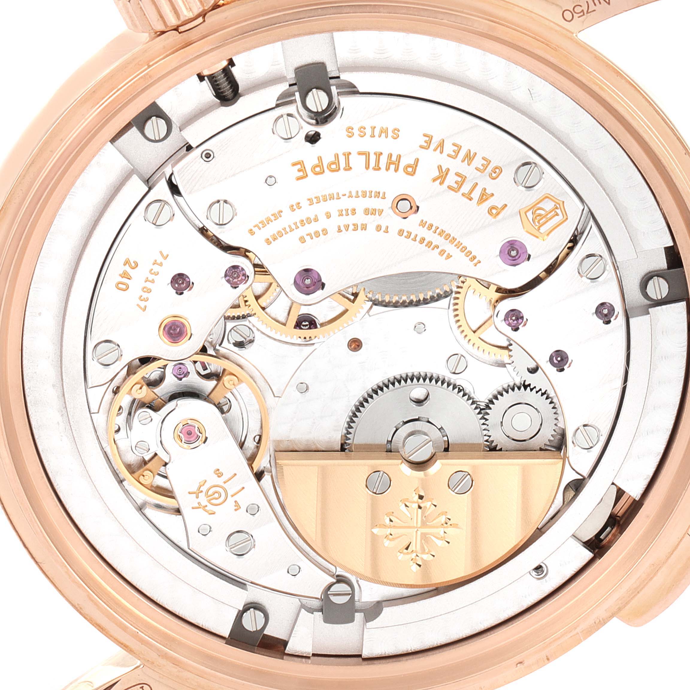 This image shows the back case of a Patek Philippe Complications 5230R Men's Rose Gold Grey Dial 5230R Men's Rose Gold Grey Dial watch, highlighting its intricate movement and inner mechanisms.