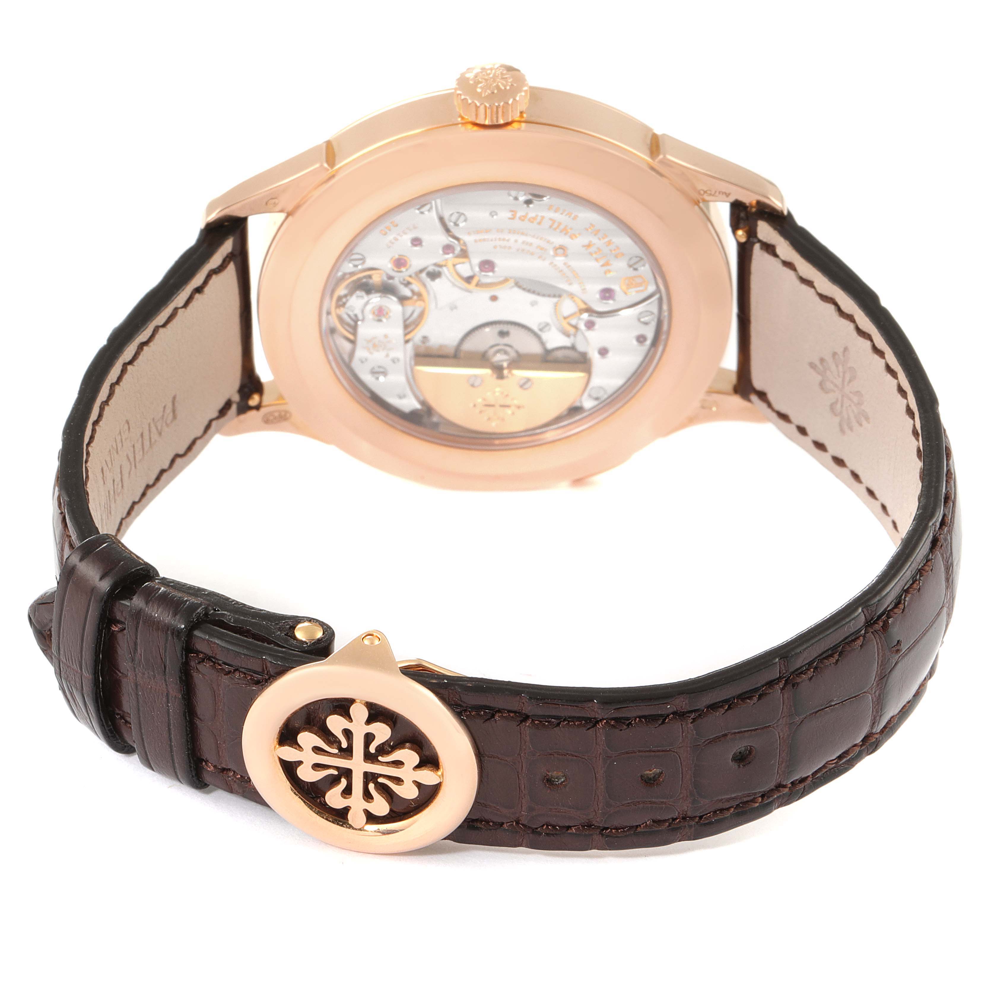 The image shows the back view of a Patek Philippe Complications 5230R Men's Rose Gold Grey Dial 5230R Men's Rose Gold Grey Dial model, highlighting the movement and leather strap.