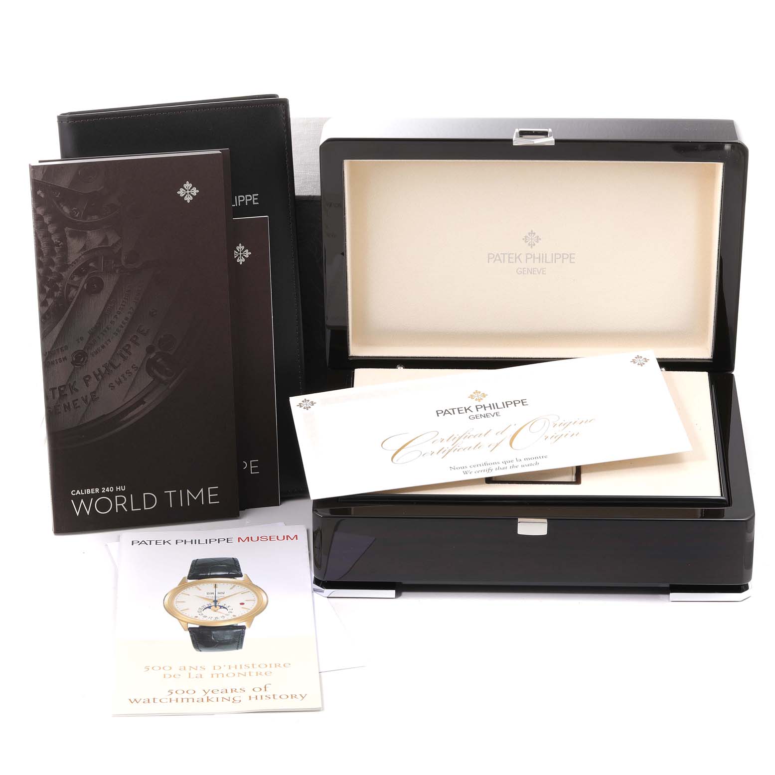 The image shows the packaging and accessories of the Patek Philippe Complications 5230R Men's Rose Gold Grey Dial 5230R Men's Rose Gold Grey Dial model, including the box, certificate, and booklets.