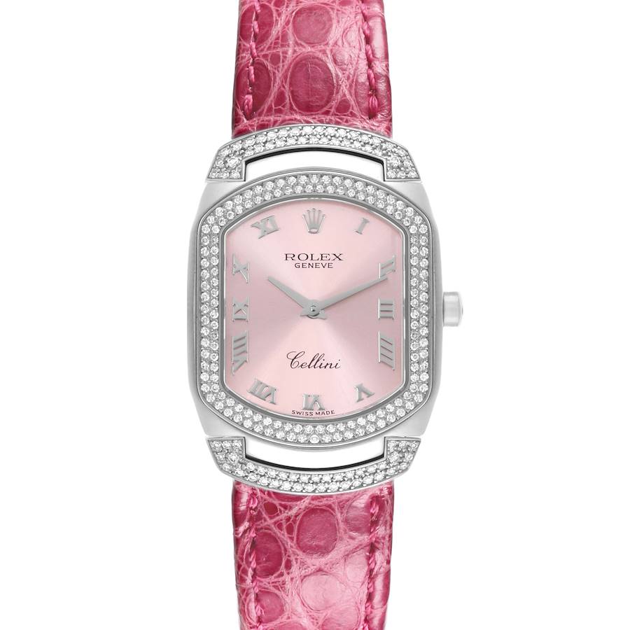 The Rolex Cellini watch is shown from the front, highlighting its pink dial, diamond bezel, and pink strap.