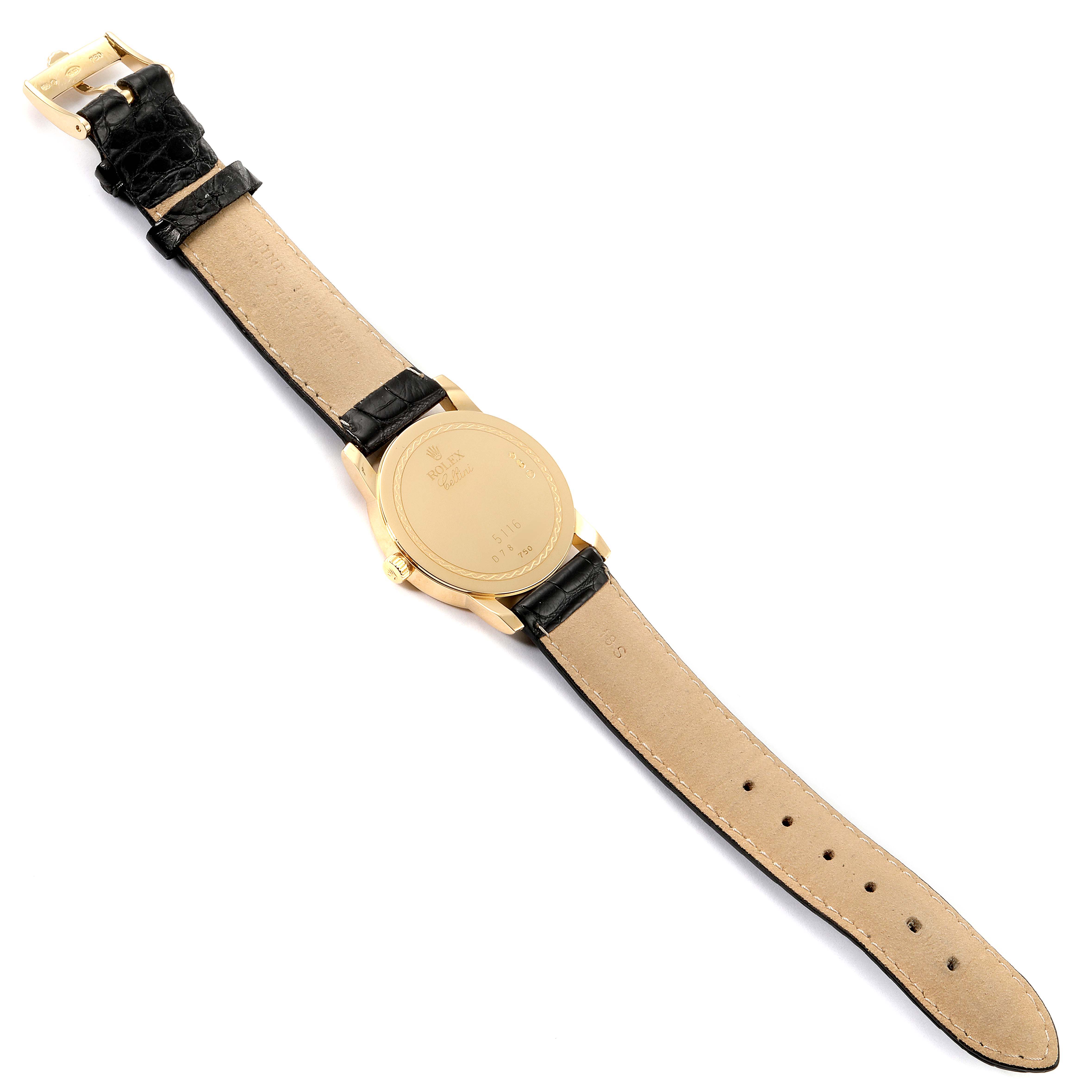 The image shows the backside of a Rolex Cellini 5116/8 Men's Yellow Gold Beige Dial 5116/8 Men's Yellow Gold Beige Dial watch, highlighting the strap and case back.
