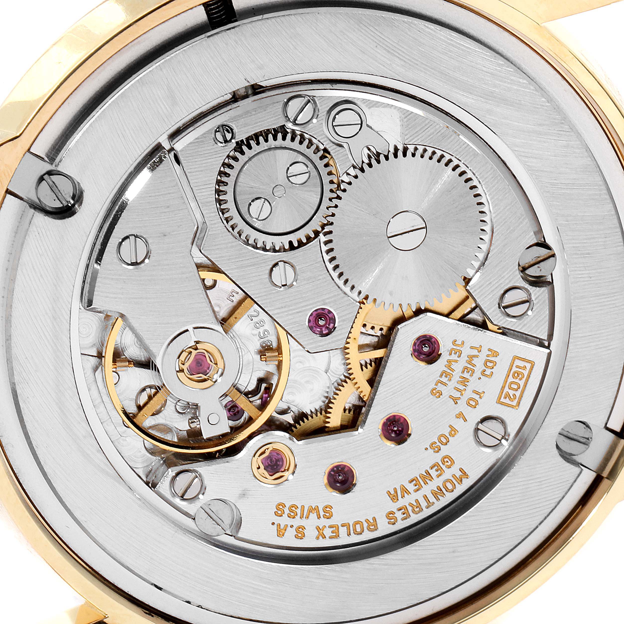 This close-up image shows the intricate mechanical movement of the Rolex Cellini 5116/8 Men's Yellow Gold Beige Dial 5116/8 Men's Yellow Gold Beige Dial watch model.
