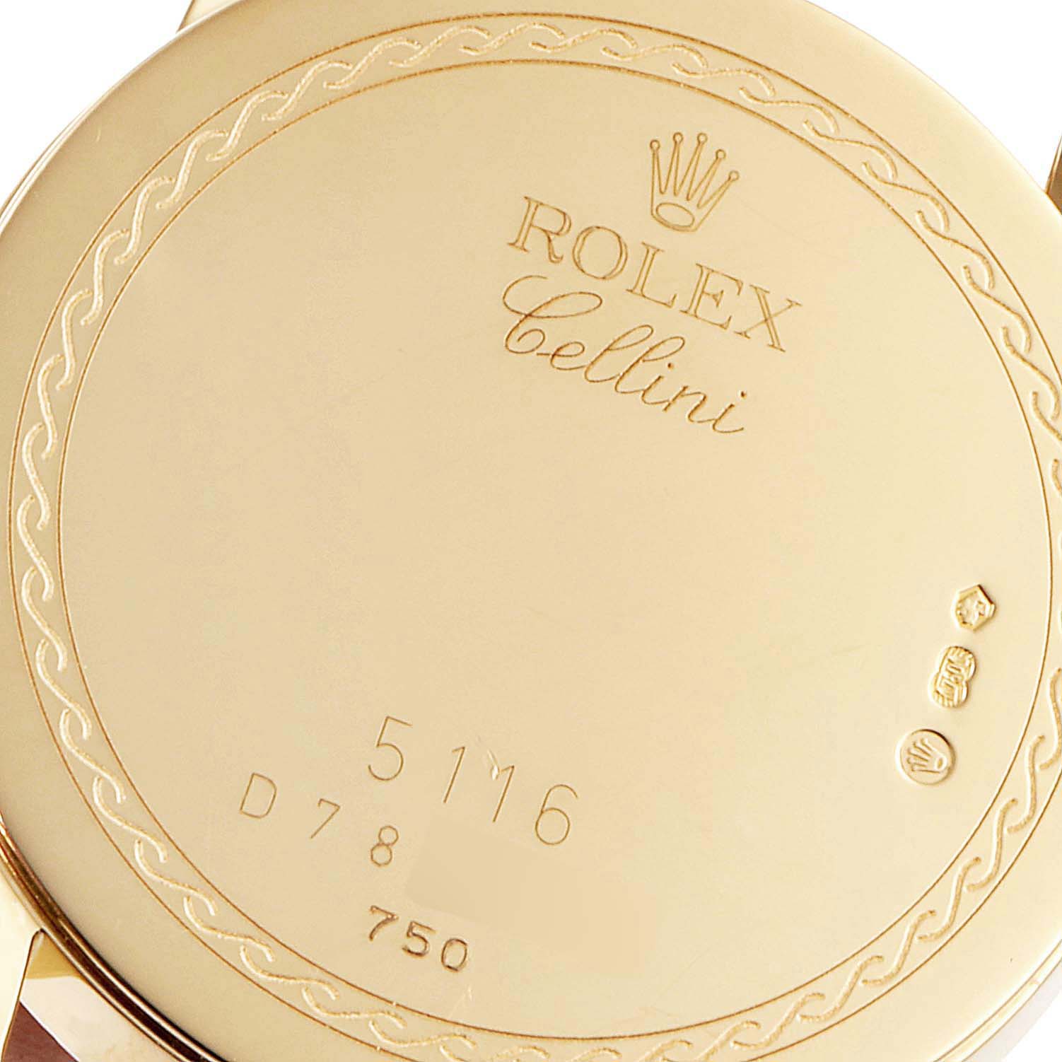 This shows the back case of a Rolex Cellini 5116/8 Men's Yellow Gold Beige Dial 5116/8 Men's Yellow Gold Beige Dial model watch, highlighting its engravings and hallmark stamps.