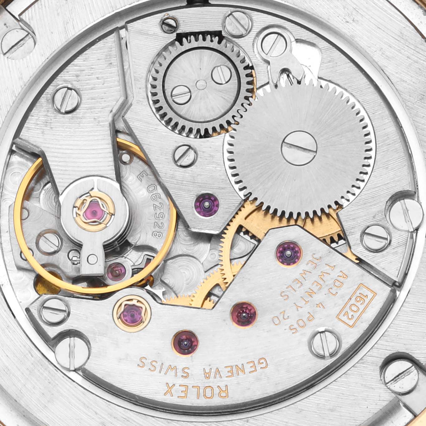 The image shows a detailed view of the Rolex Cellini 4233 Men's Yellow Gold White Dial 4233 Men's Yellow Gold White Dial watch movement, highlighting gears and mechanical components.