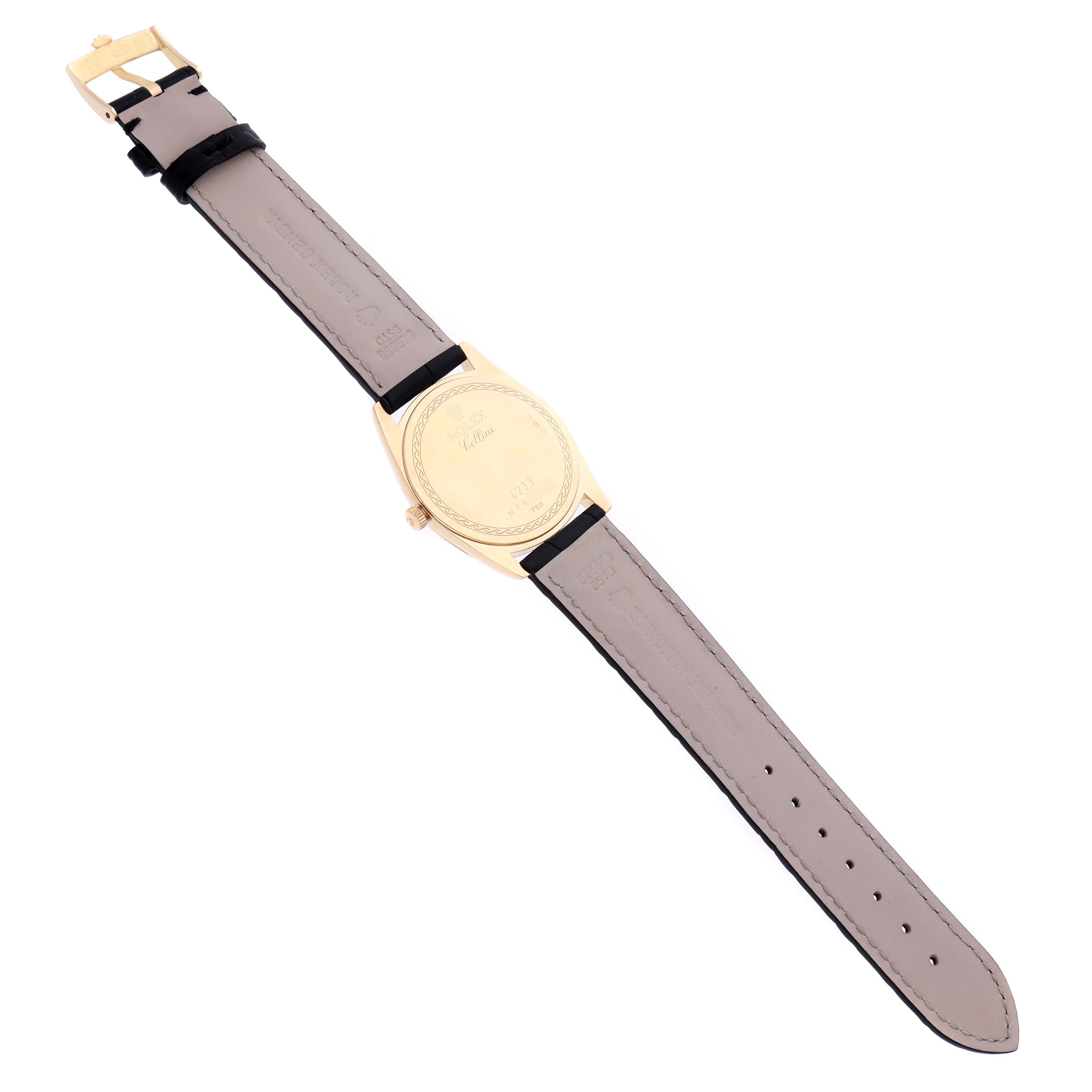 The Rolex Cellini 4233 Men's Yellow Gold White Dial 4233 Men's Yellow Gold White Dial watch is shown from the back, displaying the case back and leather strap.
