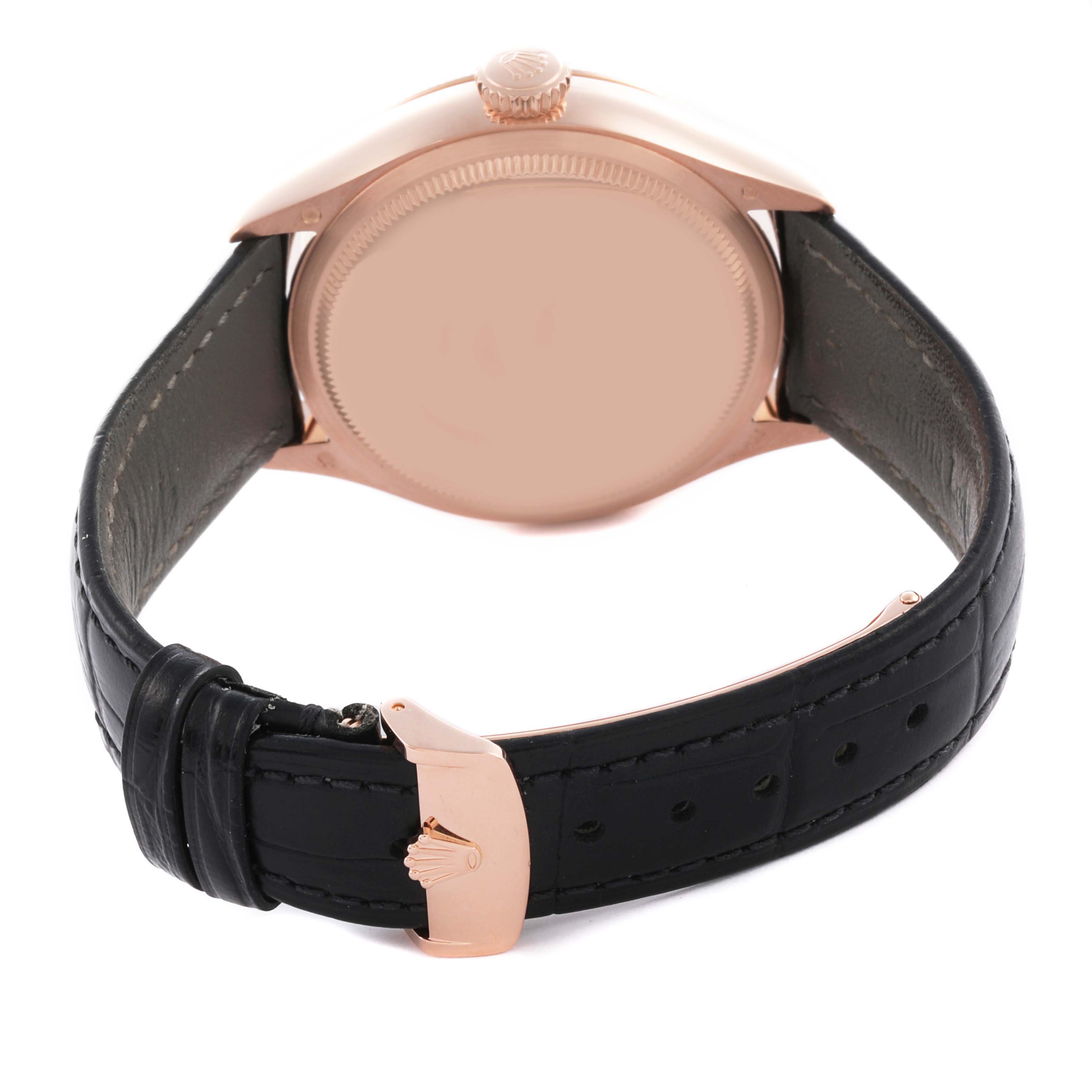 The Rolex Cellini 50535 Men's Rose Gold White Dial 50535 Men's Rose Gold White Dial watch is shown from the back, displaying the case, crown, and black leather strap with a clasp.