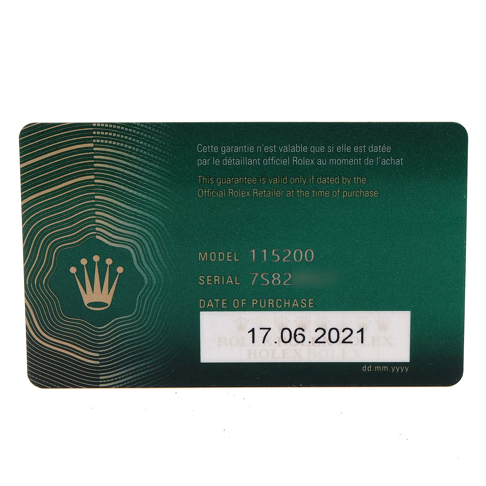 The image shows a warranty card angled from above for a Rolex Date 115200 Men's Stainless Steel Pink Dial 115200 Men's Stainless Steel Pink Dial model, displaying model and serial numbers.