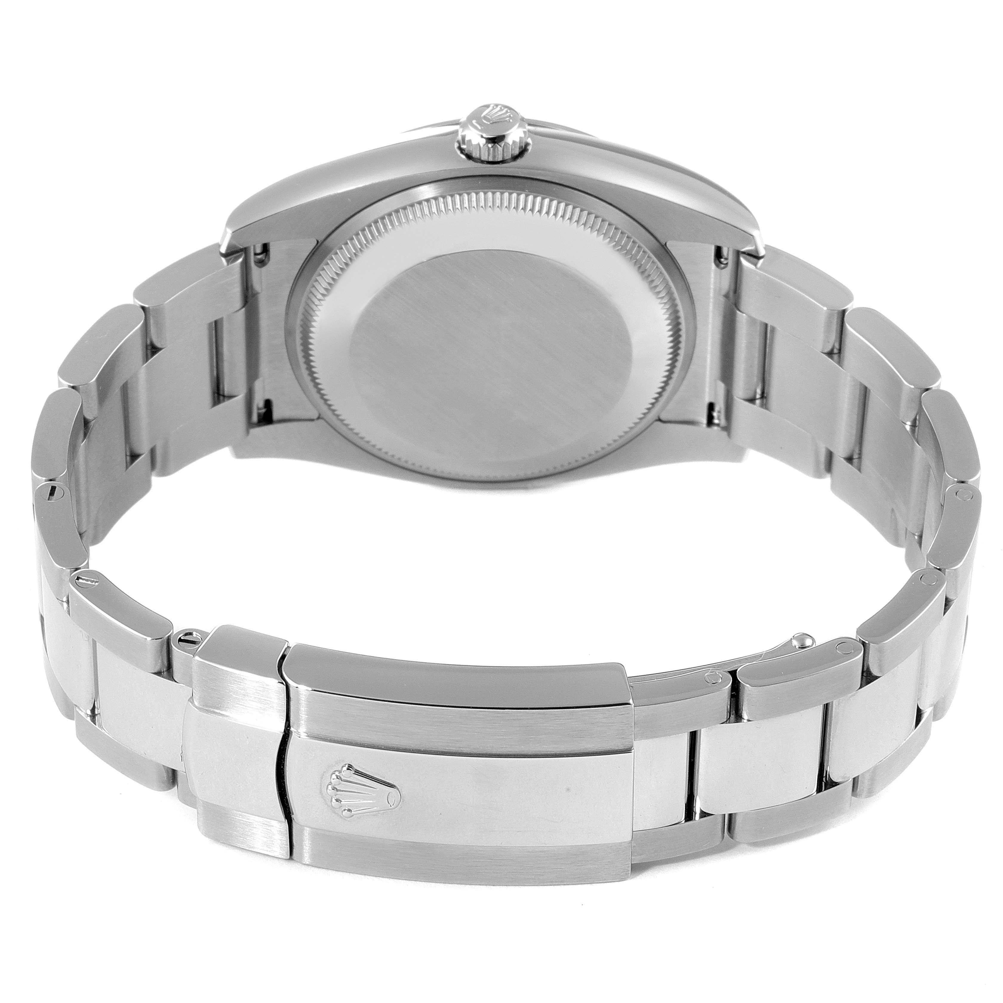 This image shows the back view of a Rolex Date 115200 Men's Stainless Steel Pink Dial 115200 Men's Stainless Steel Pink Dial watch, displaying the case back, crown, and metal bracelet with the clasp.