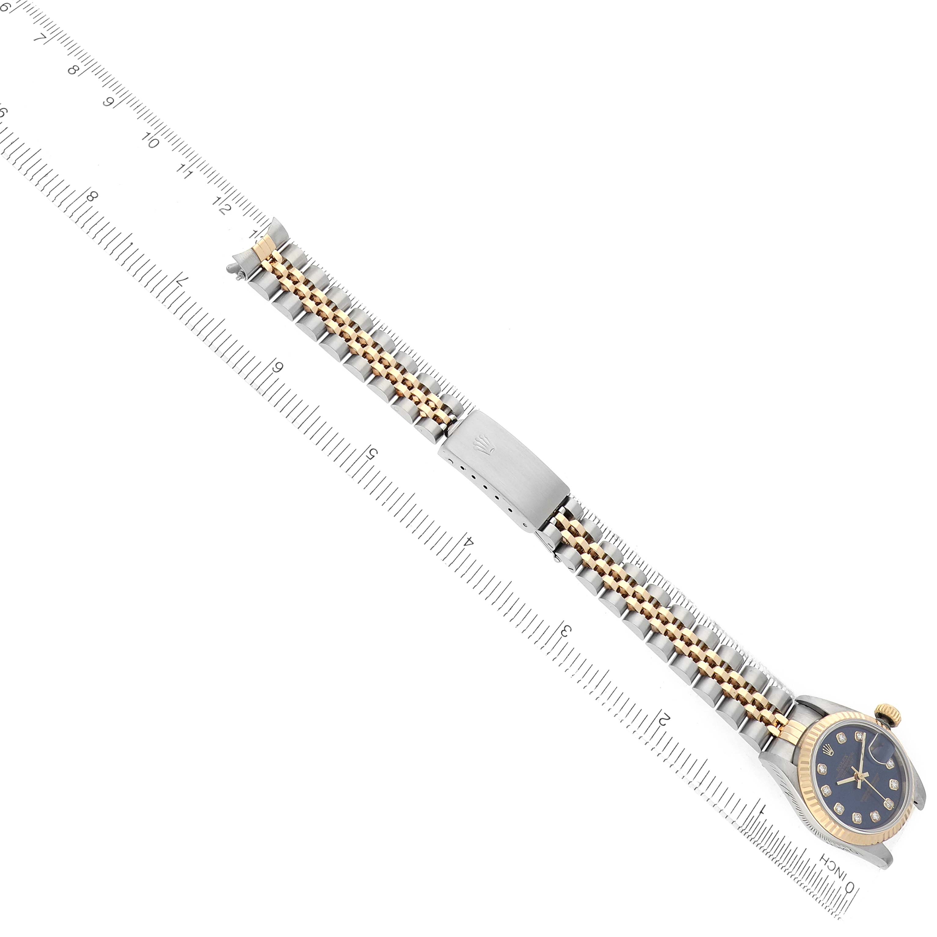 The Rolex Datejust 69173 Women's Steel and Gold (two tone) Blue Dial watch is shown from a top-down angle, featuring the bracelet, clasp, and watch face.