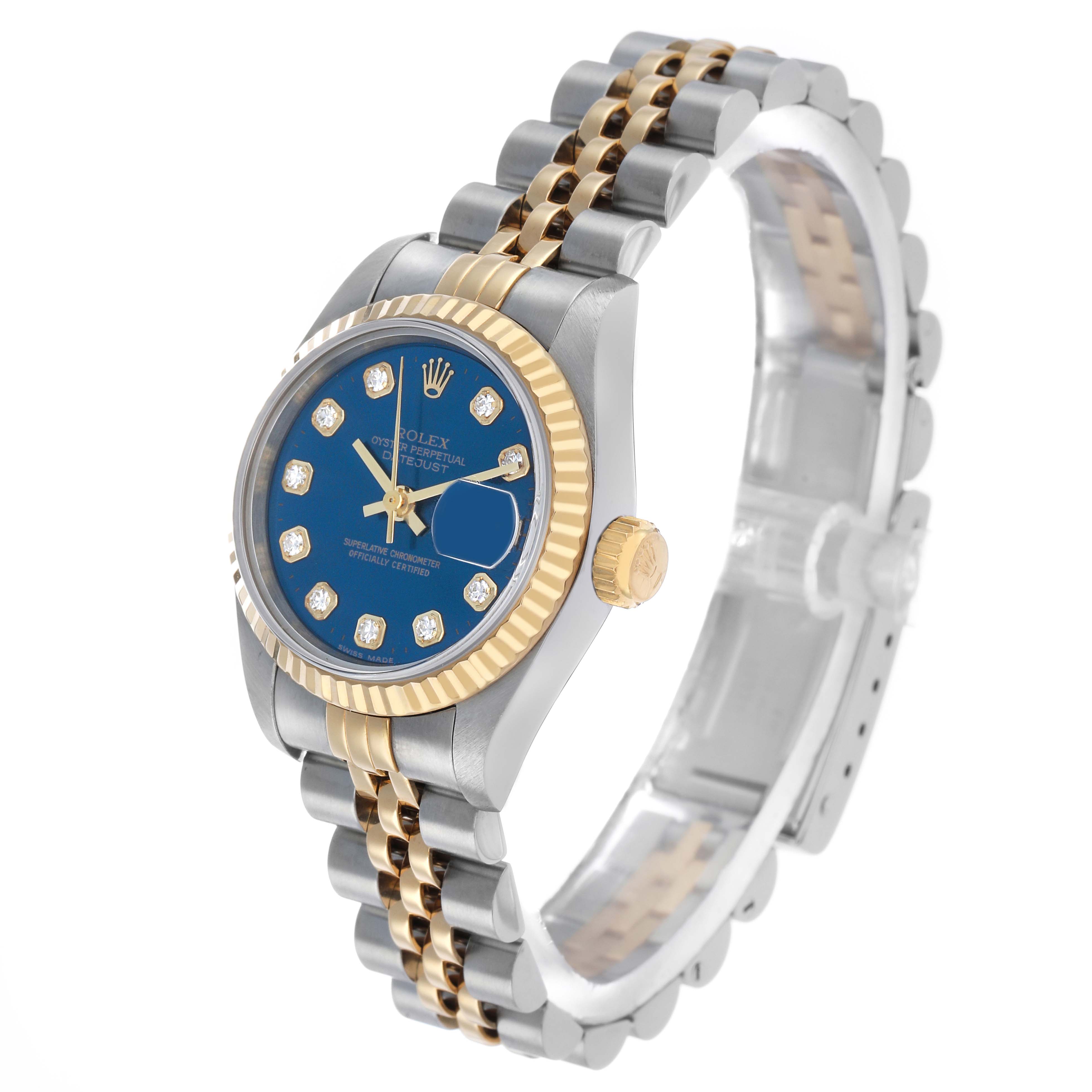 The Rolex Datejust 69173 Women's Steel and Gold (two tone) Blue Dial watch is shown at an angled side view, highlighting its blue dial, fluted bezel, and two-tone bracelet.