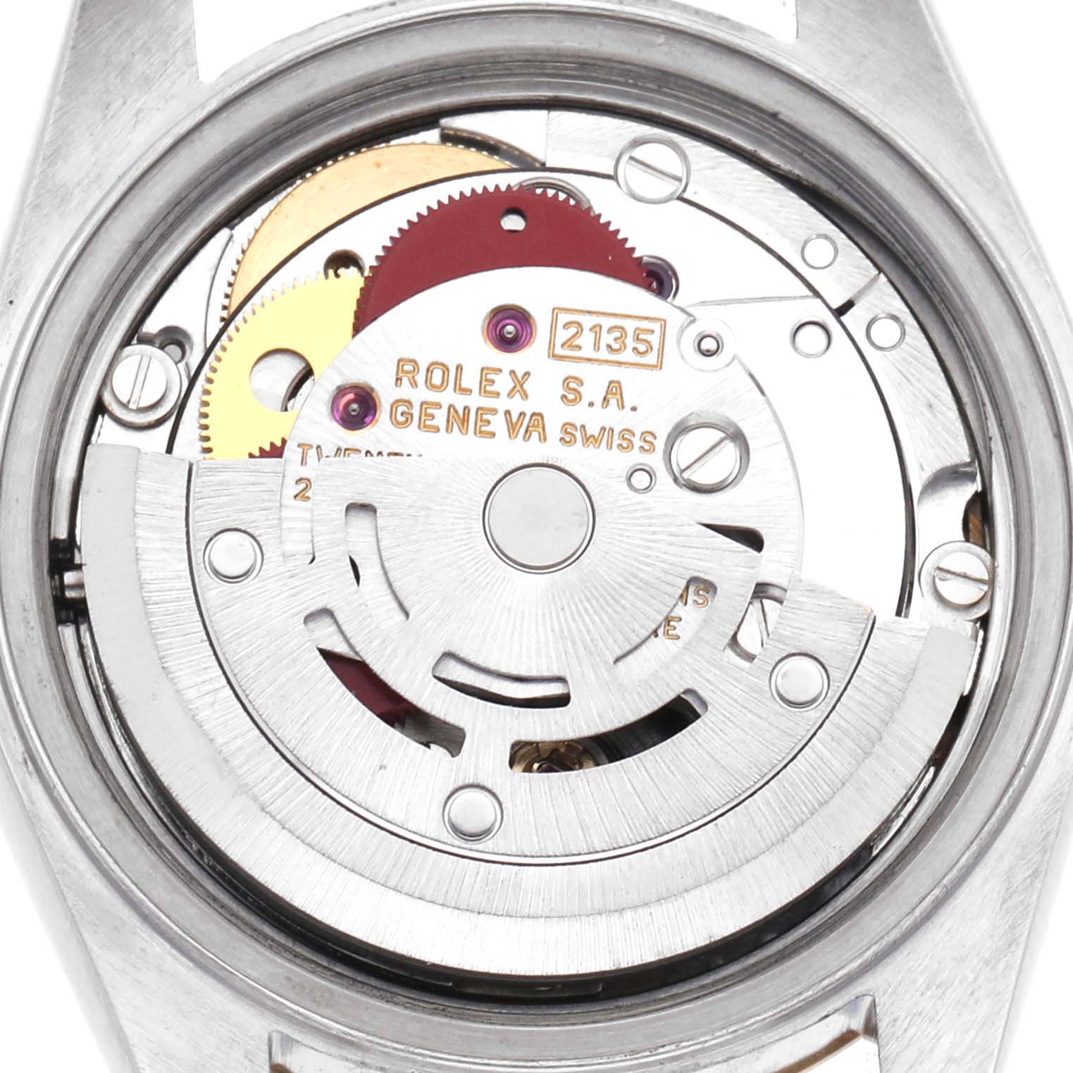The image shows the movement of a Rolex Datejust 69173 Men's Steel and Gold (two tone) Champagne Dial watch from the back, highlighting the rotor and inner mechanics.