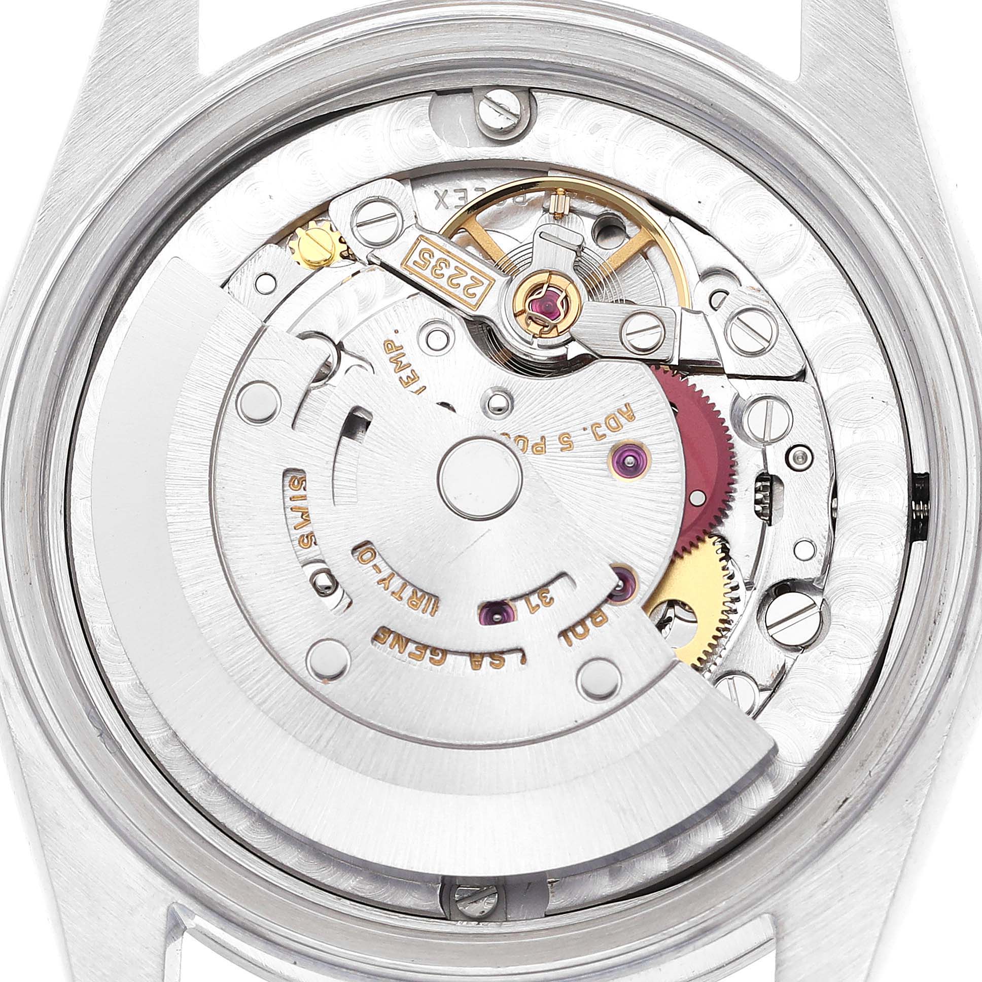 This image shows a close-up of the movement mechanism of a mid-size Rolex watch from the back.