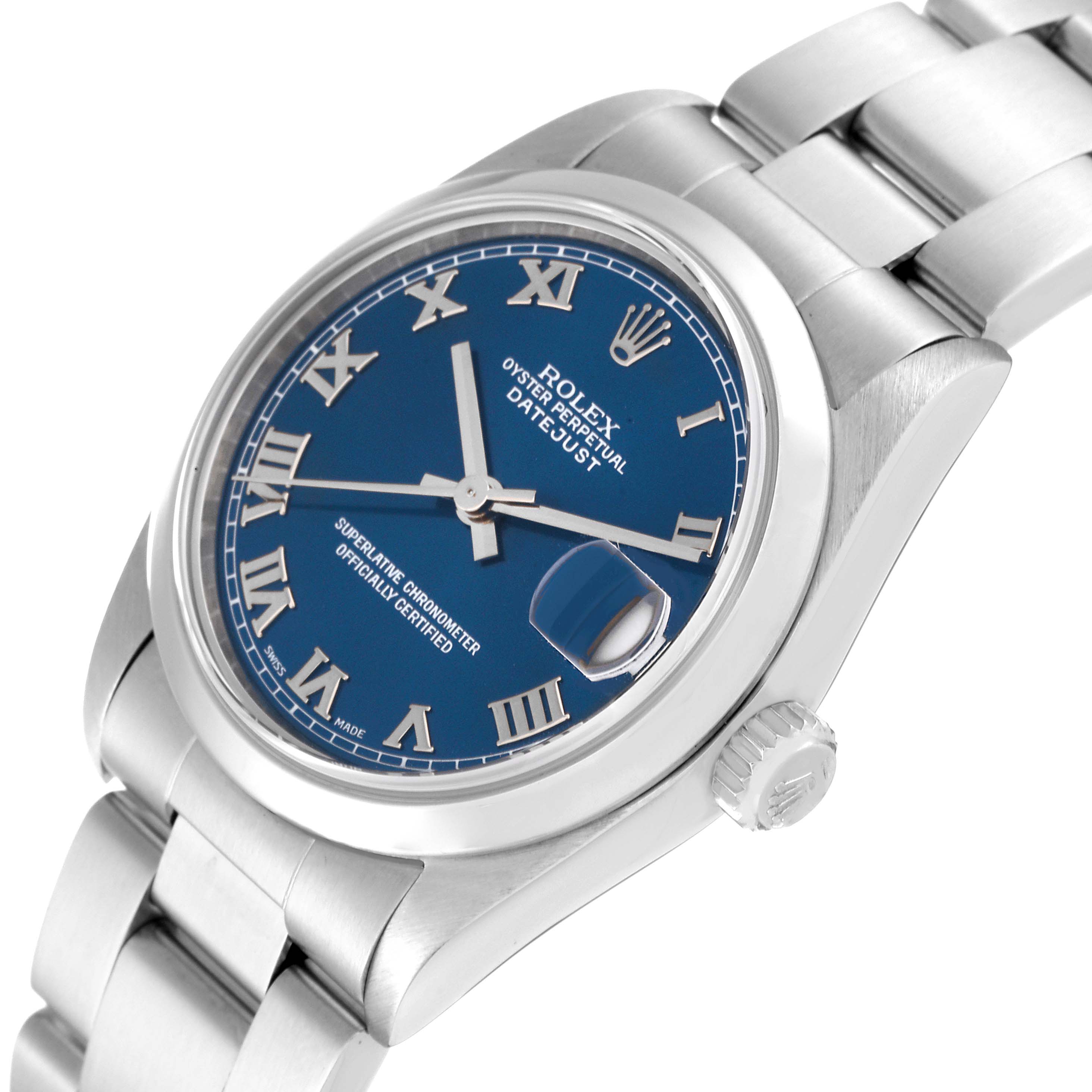 The image shows a Mid-Size Rolex Datejust watch at an angled top-down view, highlighting the dial, bracelet, and crown.