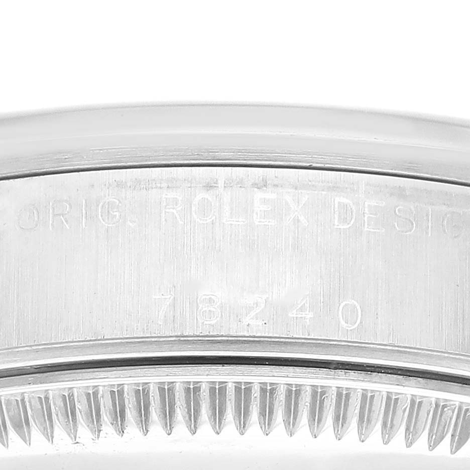 This image shows the side engraving on the bezel of a Rolex Mid-Size 78240 Women
s Stainless Steel Blue Dial 78240 Women
s Stainless Steel Blue Dial model, including "Orig. Rolex Design" and the model number "78240."