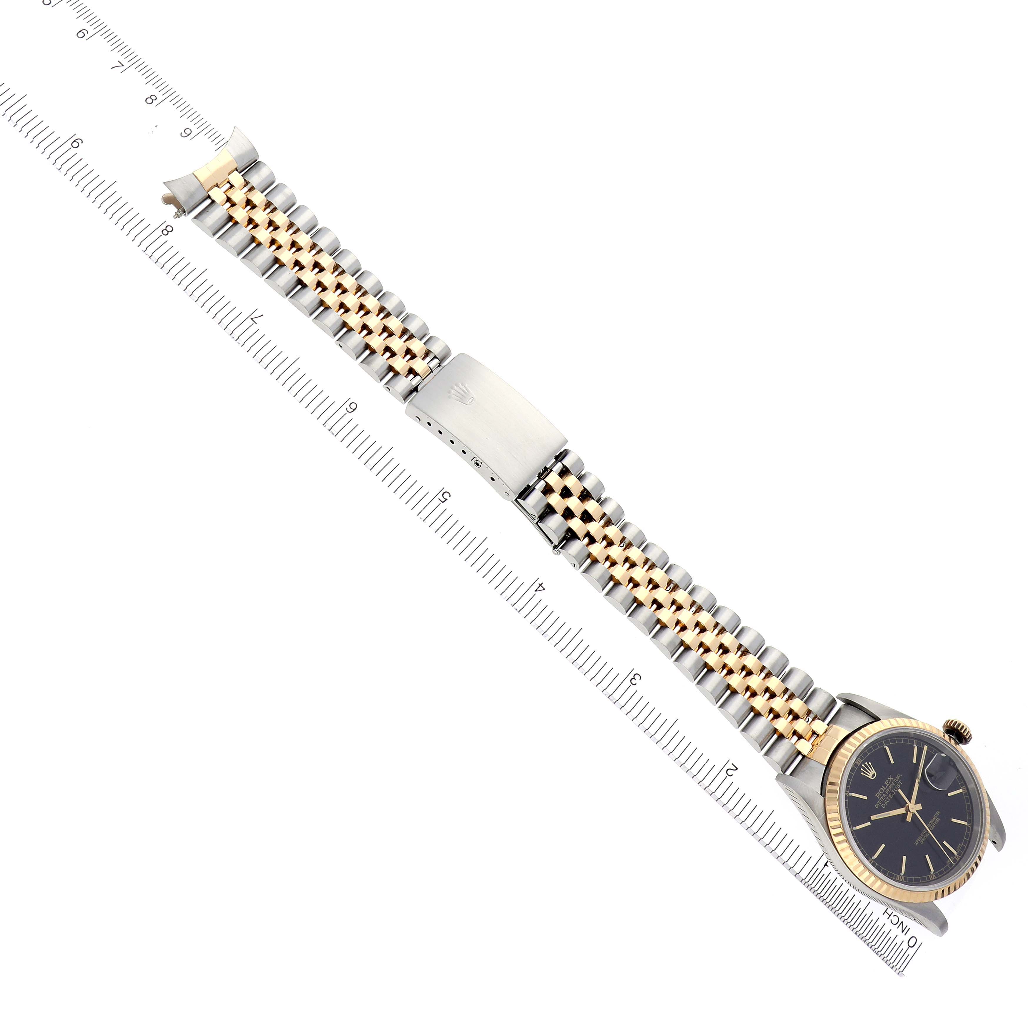 The Rolex Datejust 16233 Men's Steel and Gold (two tone) Black Dial 16233 Men's Steel and Gold (two tone) Black Dial watch is shown from a top view, displaying the face, bracelet, and clasp.