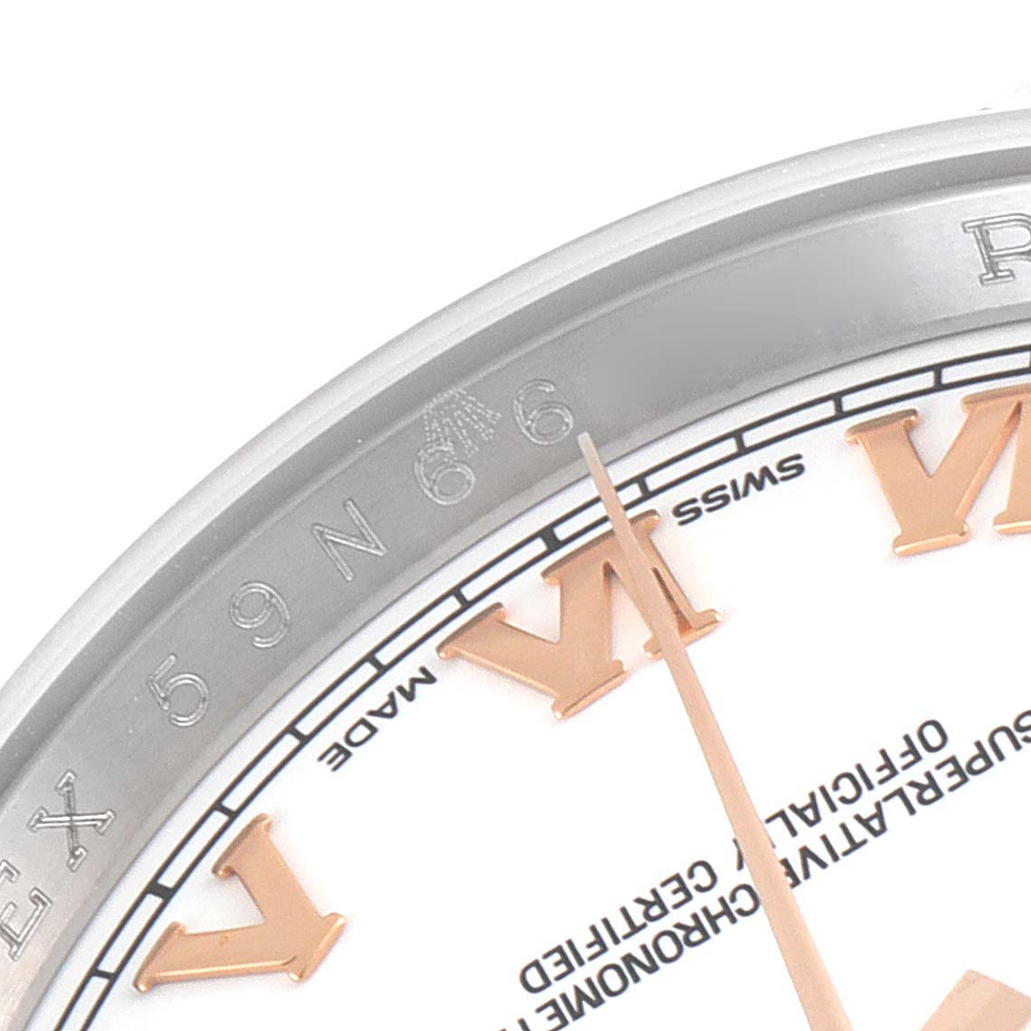 This close-up image shows a section of the bezel, dial, and hour markers of a Rolex Datejust 116231 Men's Steel and Gold (two tone) White Dial 116231 Men's Steel and Gold (two tone) White Dial watch.