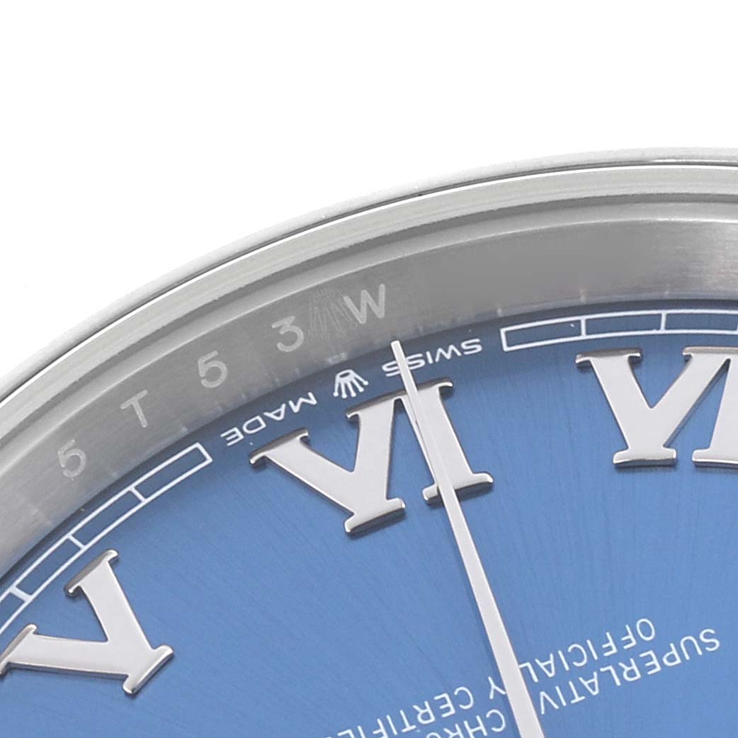 The image shows a close-up of the bezel and dial of a Rolex Datejust 41 126300 Men's Stainless Steel Blue Dial 126300 Men's Stainless Steel Blue Dial, highlighting the Roman numeral VI and the "SWISS MADE" text.