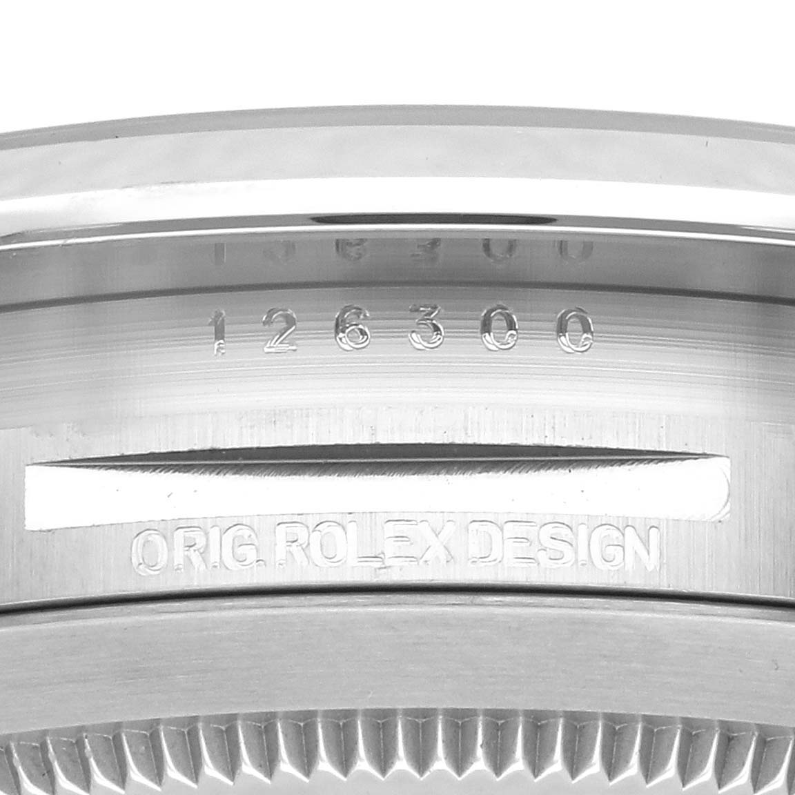 The image shows a close-up of the Rolex Datejust 41 126300 Men's Stainless Steel Blue Dial 126300 Men's Stainless Steel Blue Dial model case side, featuring engravings and the fluted bezel edge.