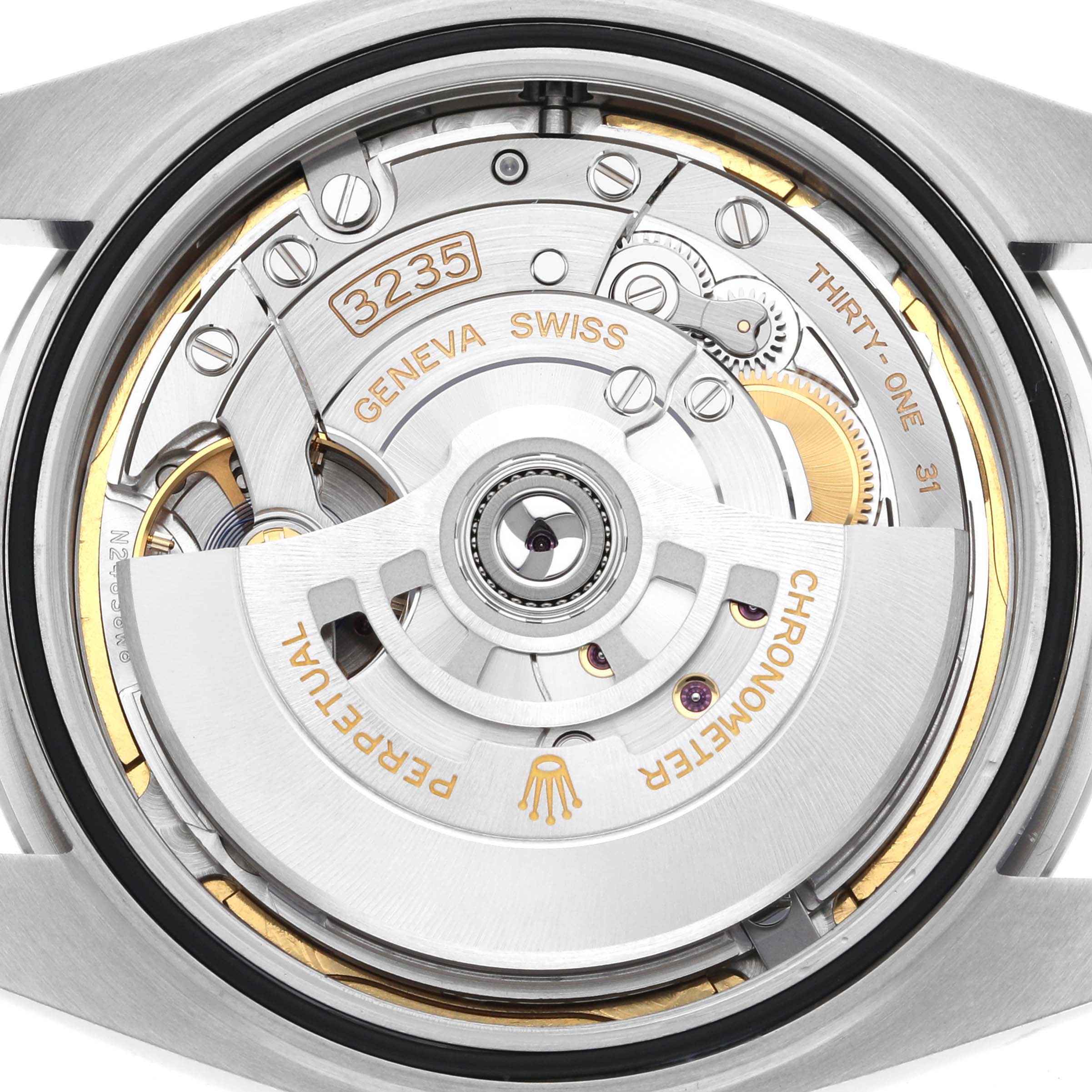 The image shows the movement mechanism of the Rolex Datejust 41 126300 Men's Stainless Steel Blue Dial 126300 Men's Stainless Steel Blue Dial, highlighting the rotor and internal components from the back.