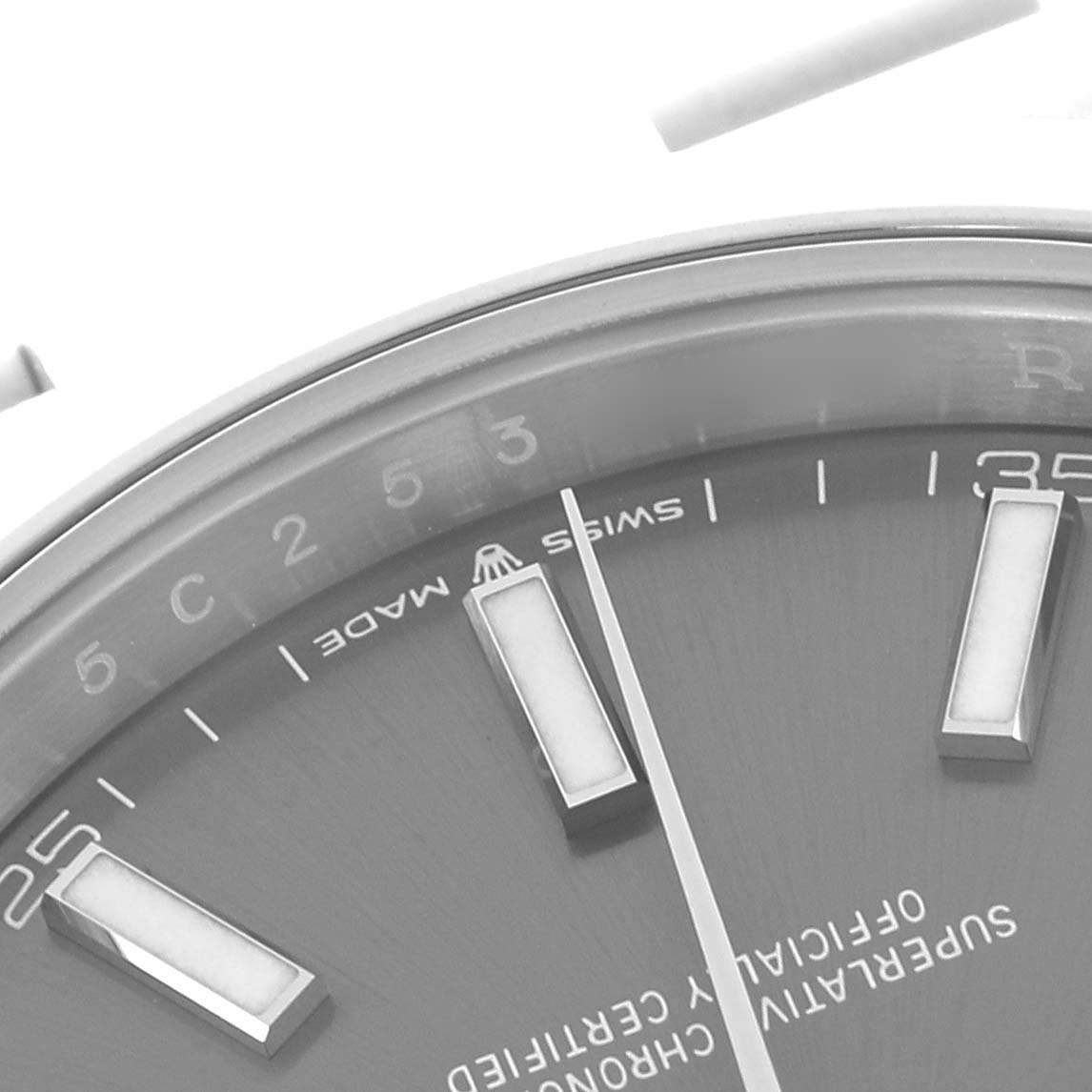 The image shows a close-up of the Rolex Datejust 41 126300 Men's Stainless Steel Grey Dial 126300 Men's Stainless Steel Grey Dial dial, highlighting the indices and partial numerals.