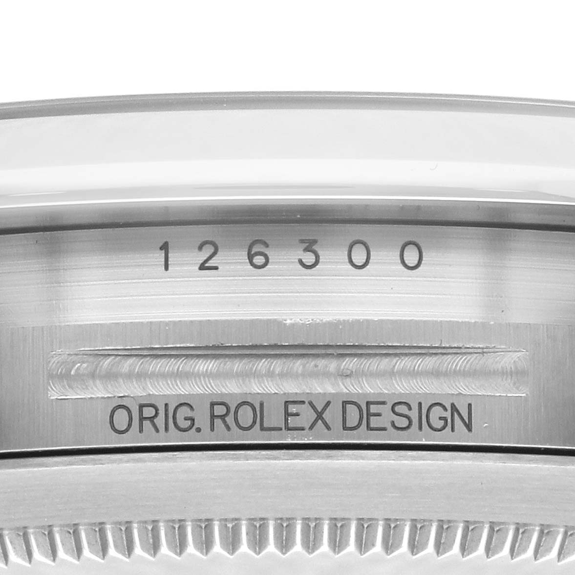 The image shows a close-up of the Rolex Datejust 41 126300 Men's Stainless Steel Grey Dial 126300 Men's Stainless Steel Grey Dial model with its serial number and "Orig. Rolex Design" engraving.