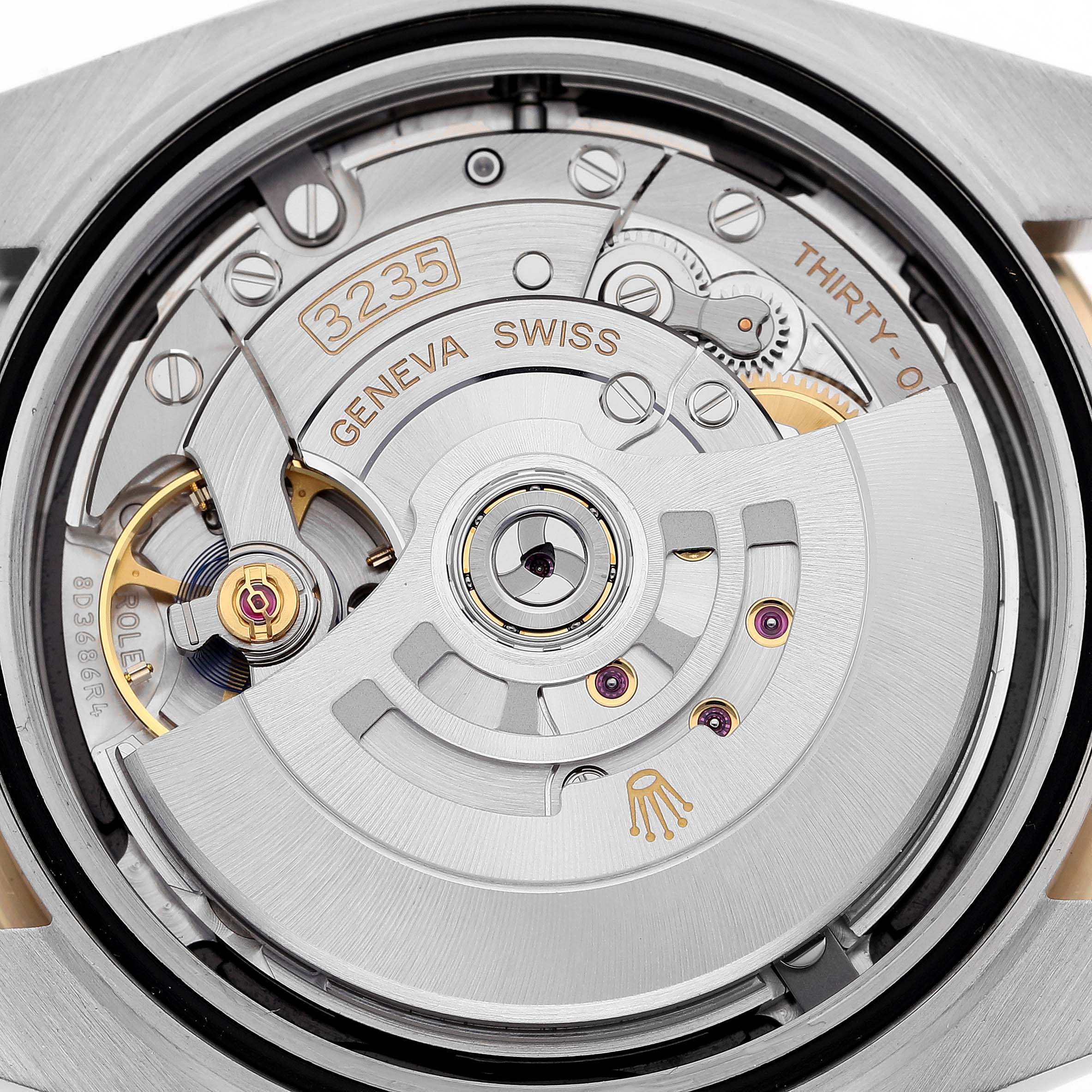 This is a close-up view of the movement inside a Rolex Datejust 41 126333 Men's Steel and Gold (two tone) Black Dial 126333 Men's Steel and Gold (two tone) Black Dial watch, showcasing its intricate mechanisms.