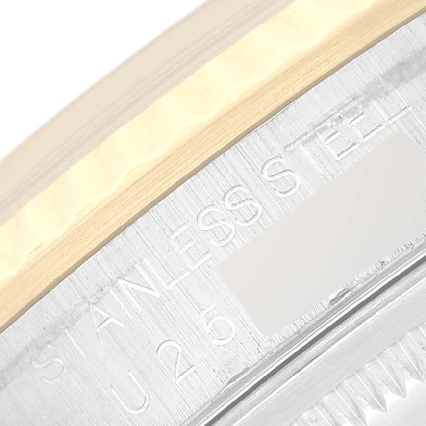Close-up of a stainless steel section and part of the bezel on a Rolex Datejust 16233 Men's Steel and Gold (two tone) White Dial 16233 Men's Steel and Gold (two tone) White Dial watch.