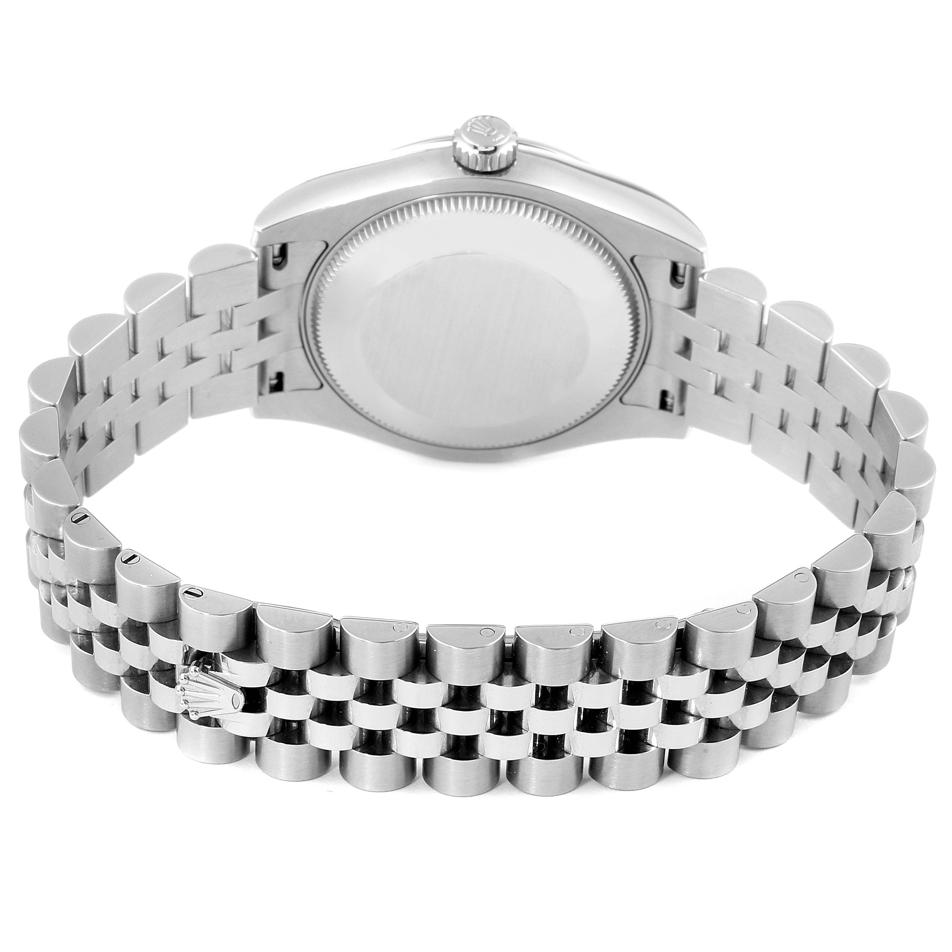 This image shows the back case and bracelet of a mid-size Rolex watch from a rear angle.