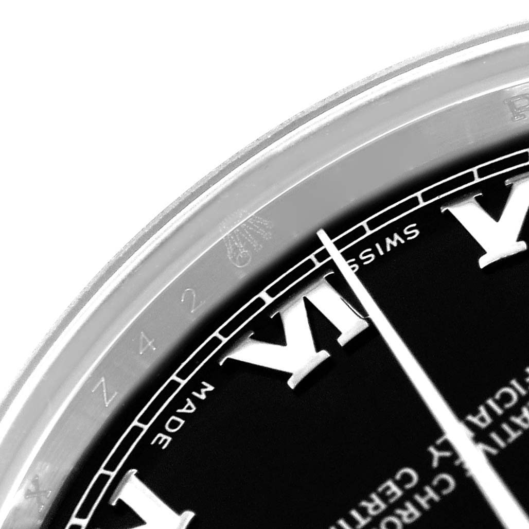 The image shows a close-up of the Rolex Mid-Size 178240 Women's Stainless Steel Black Dial 178240 Women's Stainless Steel Black Dial watch, highlighting part of the dial and Roman numerals.
