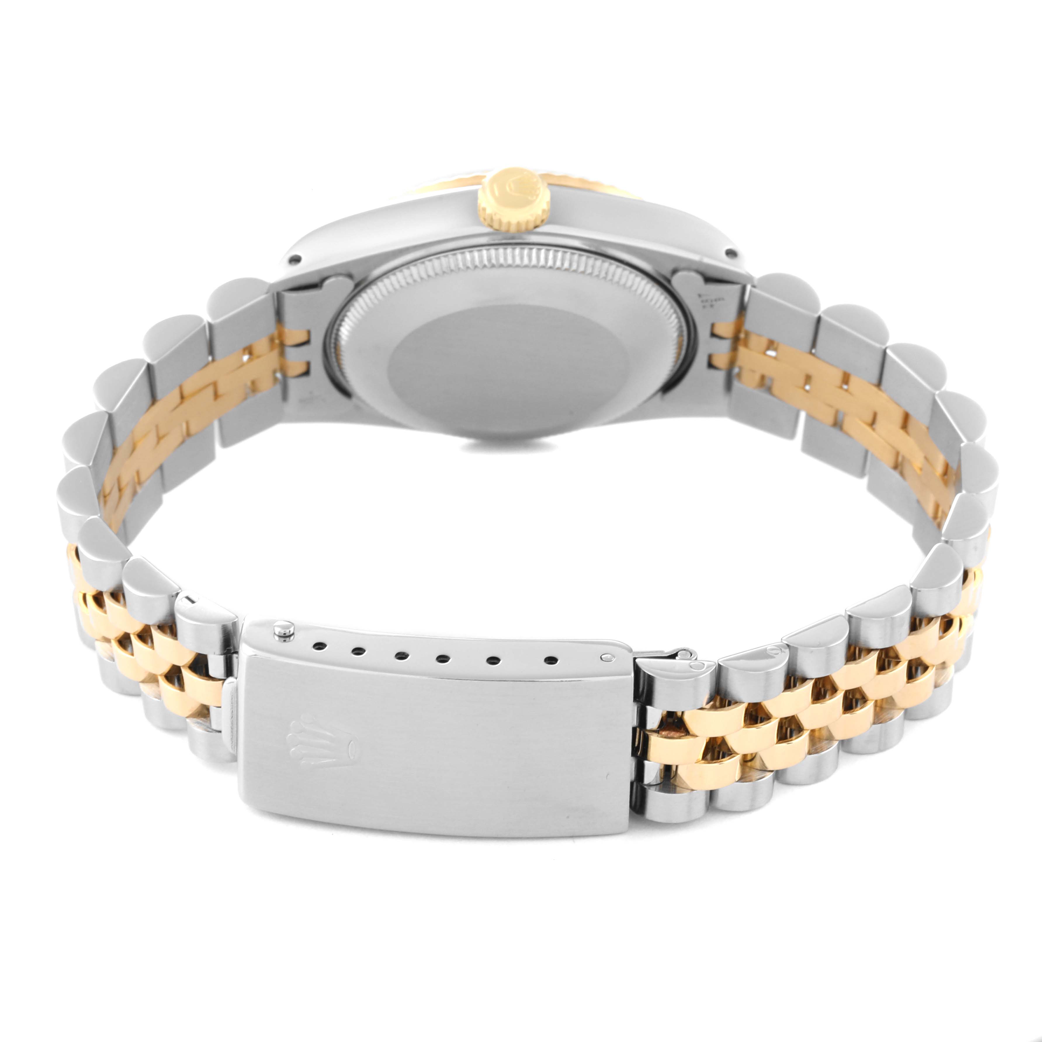The image shows the back view of a Rolex Mid-Size 68273 Women
s Steel and Gold (two tone) Champagne Dial 68273 Women
s Steel and Gold (two tone) Champagne Dial watch, highlighting the case back, crown, and two-tone bracelet.