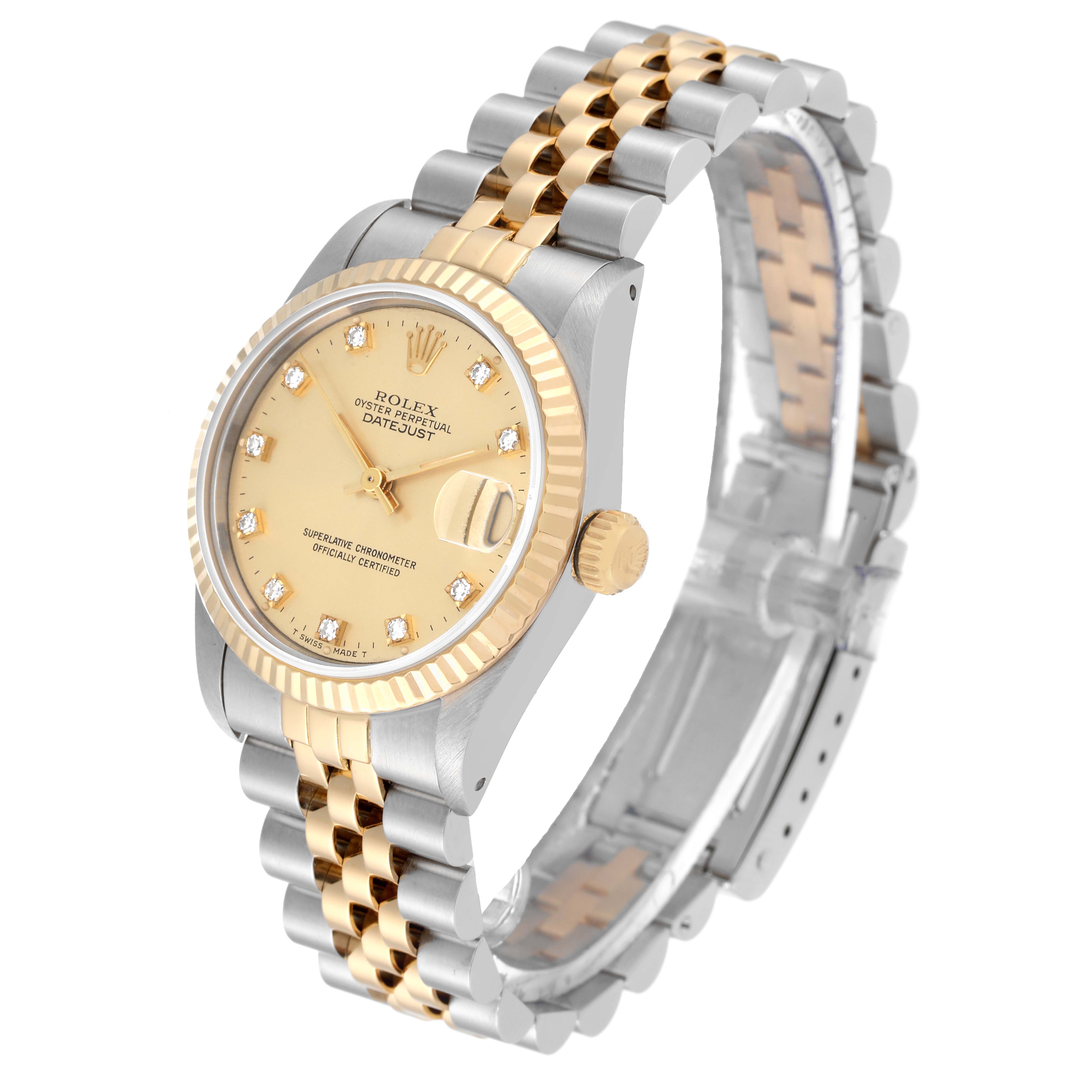 The image shows a Rolex Mid-Size 68273 Women
s Steel and Gold (two tone) Champagne Dial 68273 Women
s Steel and Gold (two tone) Champagne Dial Datejust watch at a slight angle, featuring its face, bezel, crown, and two-tone bracelet.