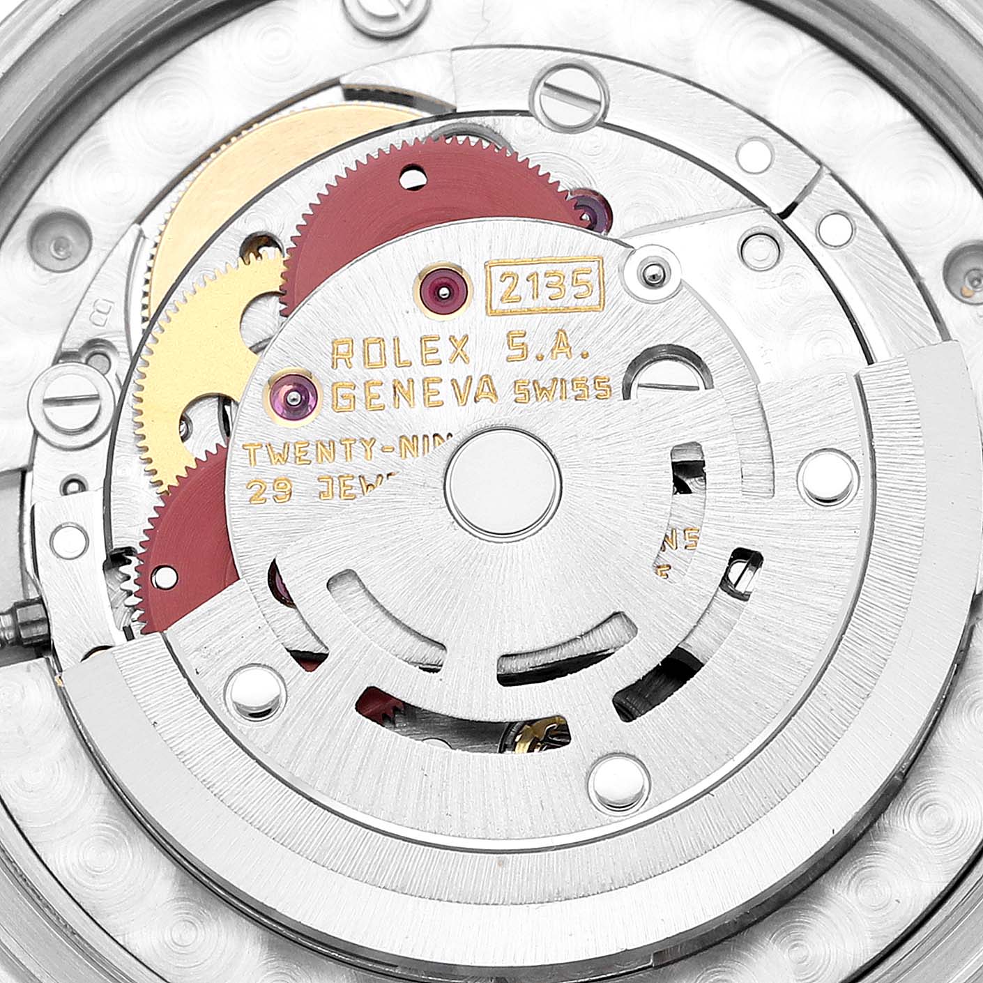 This image shows a close-up of the mechanical movement inside a Rolex Mid-Size 68273 Women
s Steel and Gold (two tone) Champagne Dial 68273 Women
s Steel and Gold (two tone) Champagne Dial watch, displaying gears and markings.