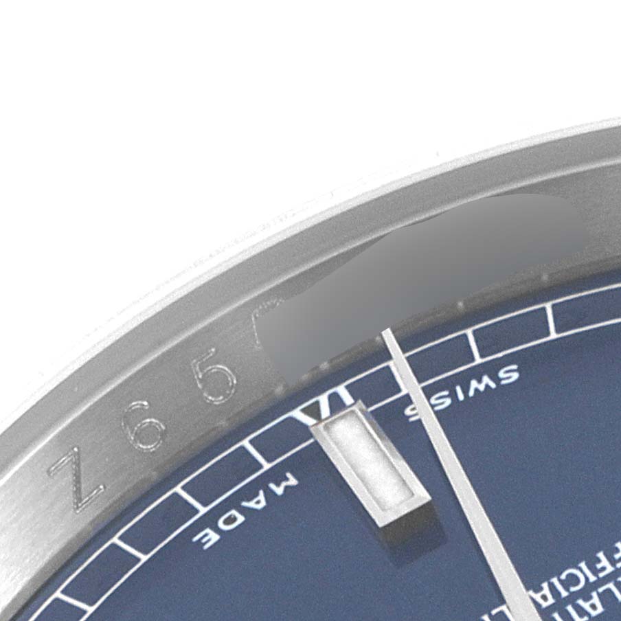 The image shows a close-up of the dial and edge of a Rolex Datejust 116234 Men's Stainless Steel Blue Dial 116234 Men's Stainless Steel Blue Dial watch, highlighting the "Swiss Made" marking and part of the serial number.