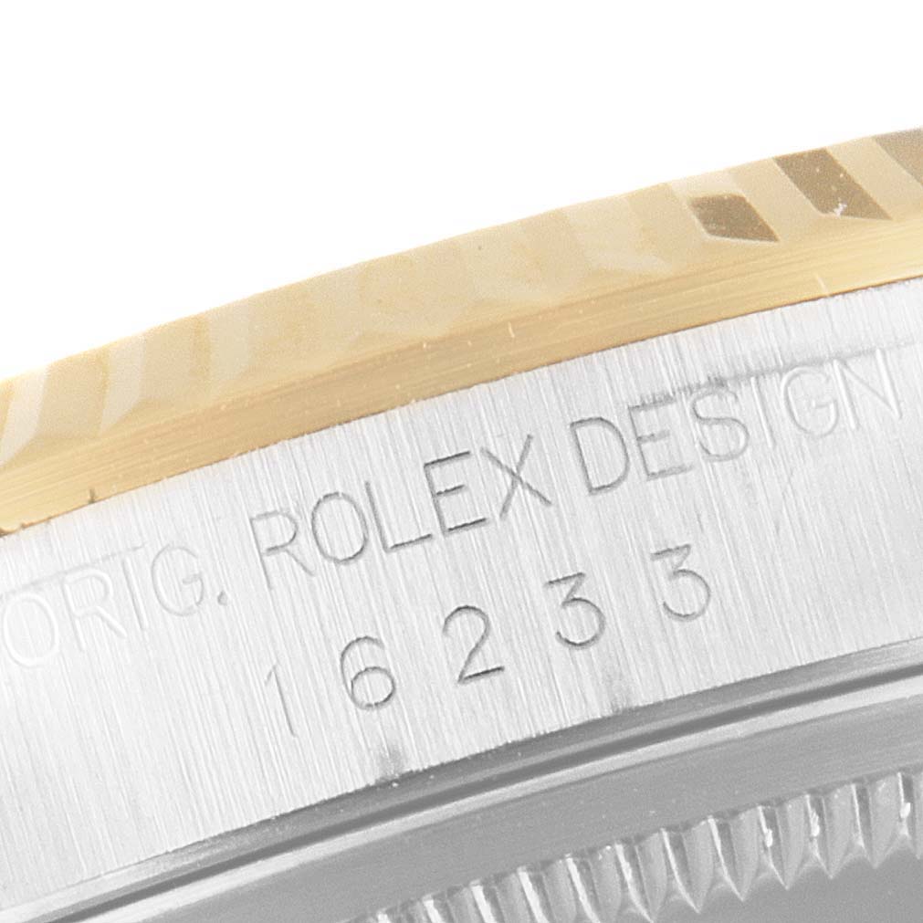 The image shows a close-up angle of the case edge and the engraved serial number on a Rolex Datejust 16233 Men's Steel and Gold (two tone) Black Dial 16233 Men's Steel and Gold (two tone) Black Dial watch.