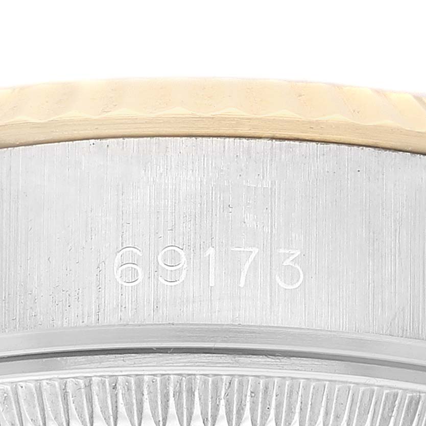 The image shows a close-up of the case side of a Rolex Datejust 69173 Women's Steel and Gold (two tone) Champagne Dial 69173 Women's Steel and Gold (two tone) Champagne Dial watch, highlighting the reference number 69173.