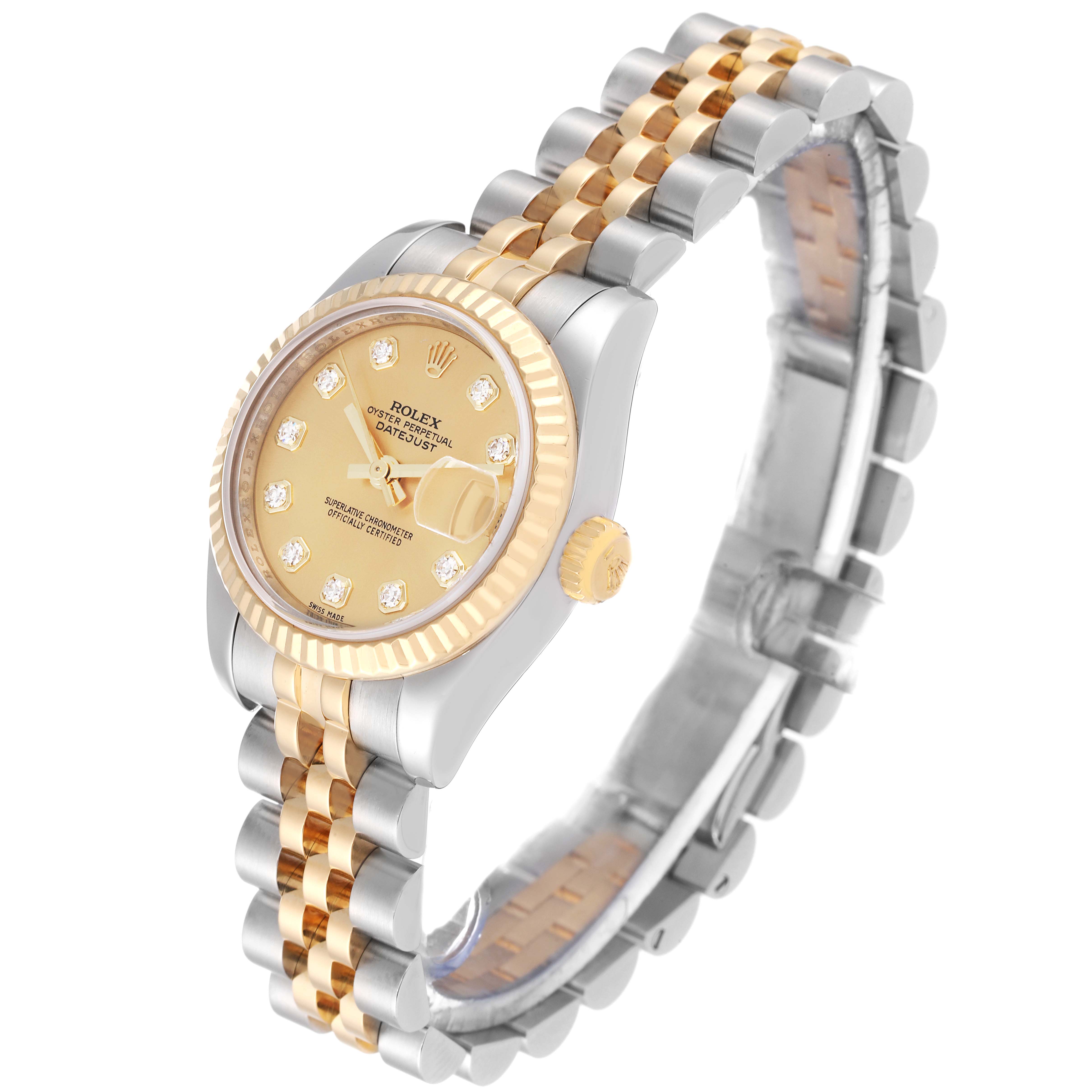 The image shows a Rolex Datejust 179173G Women's Steel and Gold (two tone) Champagne Dial 179173G Women's Steel and Gold (two tone) Champagne Dial watch with a gold dial, diamond hour markers, and a two-tone metal bracelet, viewed from a side angle.