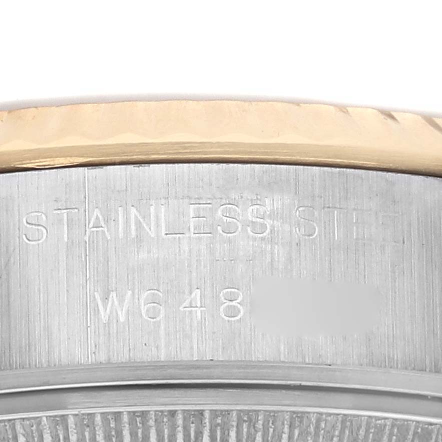 The image shows a close-up of the side of a Rolex Datejust 69173 Women's Steel and Gold (two tone) Champagne Dial 69173 Women's Steel and Gold (two tone) Champagne Dial, highlighting the stainless steel and part of the bezel.