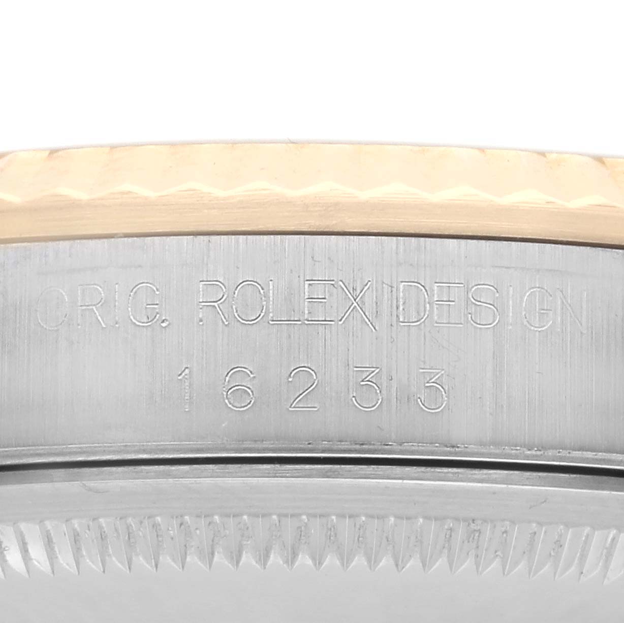 The image shows a close-up of the side of the Rolex Datejust 16233 Men
s Steel and Gold (two tone) Champagne Dial 16233 Men
s Steel and Gold (two tone) Champagne Dial watch case with engraved model details.