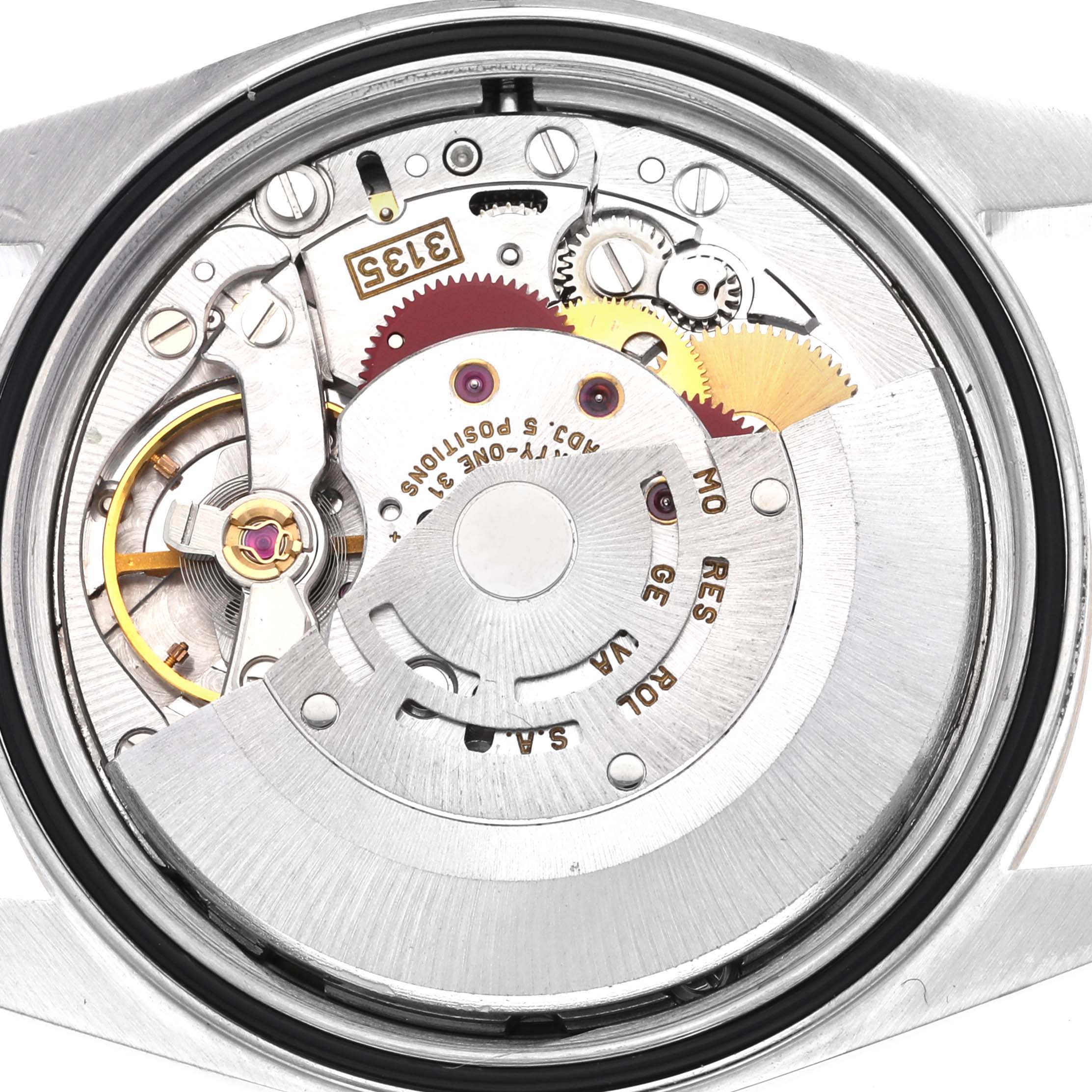 The image shows the internal movement parts of a Rolex Datejust 16233 Men
s Steel and Gold (two tone) Champagne Dial 16233 Men
s Steel and Gold (two tone) Champagne Dial watch from a back view.