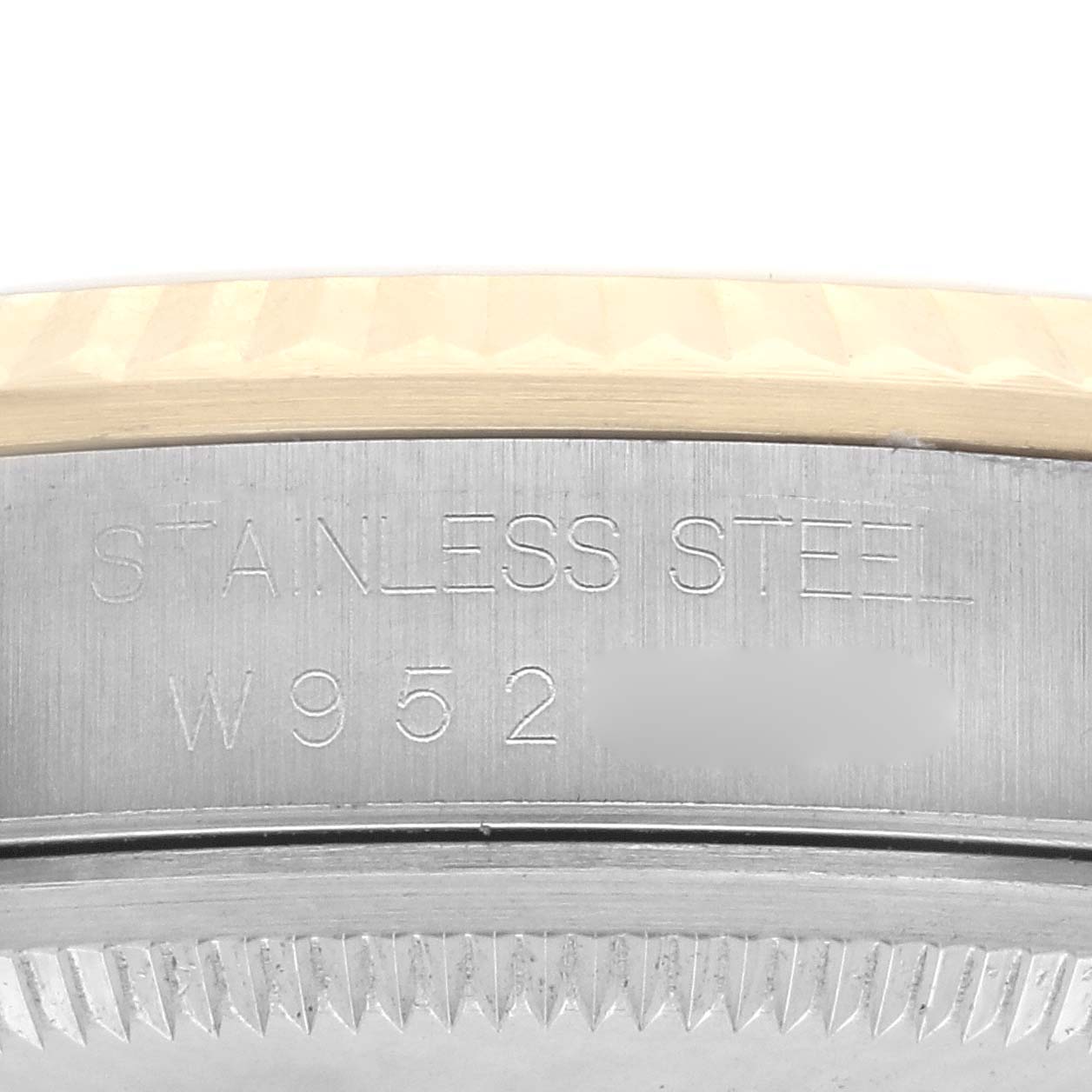 The image shows the stainless steel side and part of the fluted bezel of the Rolex Datejust 16233 Men
s Steel and Gold (two tone) Champagne Dial 16233 Men
s Steel and Gold (two tone) Champagne Dial.