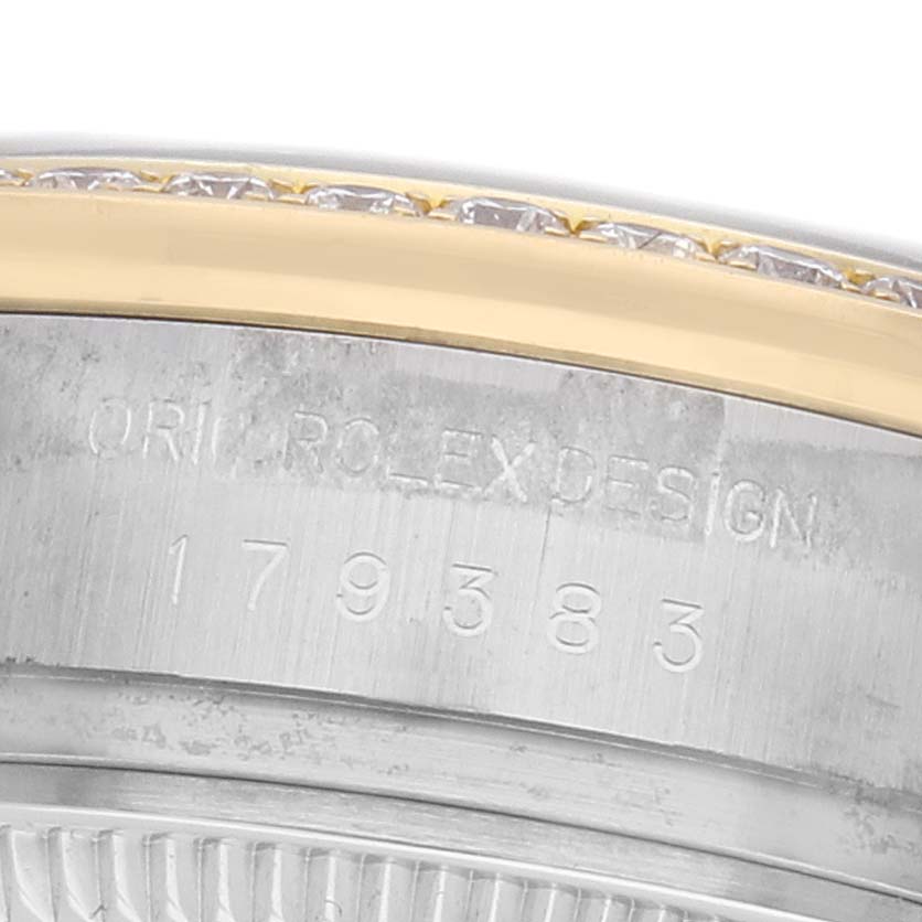 The image shows the side of a Rolex Datejust 179383 Women's Stainless Steel Black Dial, highlighting the engraved serial number and part of the bezel.