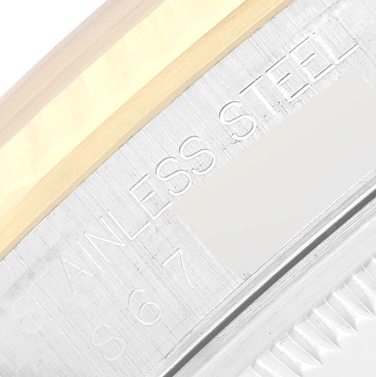 The image shows a close-up of the stainless steel and gold bezel of a Rolex Datejust 16233 Men's Steel and Gold (two tone) White Dial 16233 Men's Steel and Gold (two tone) White Dial watch.