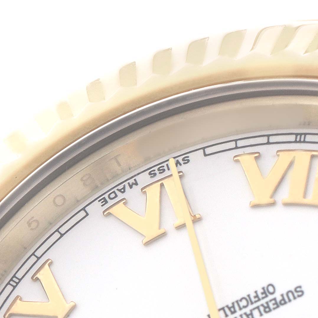 The image shows a close-up of the Rolex President 218238 Men's Yellow Gold White Dial watch face, highlighting the bezel and Roman numerals.