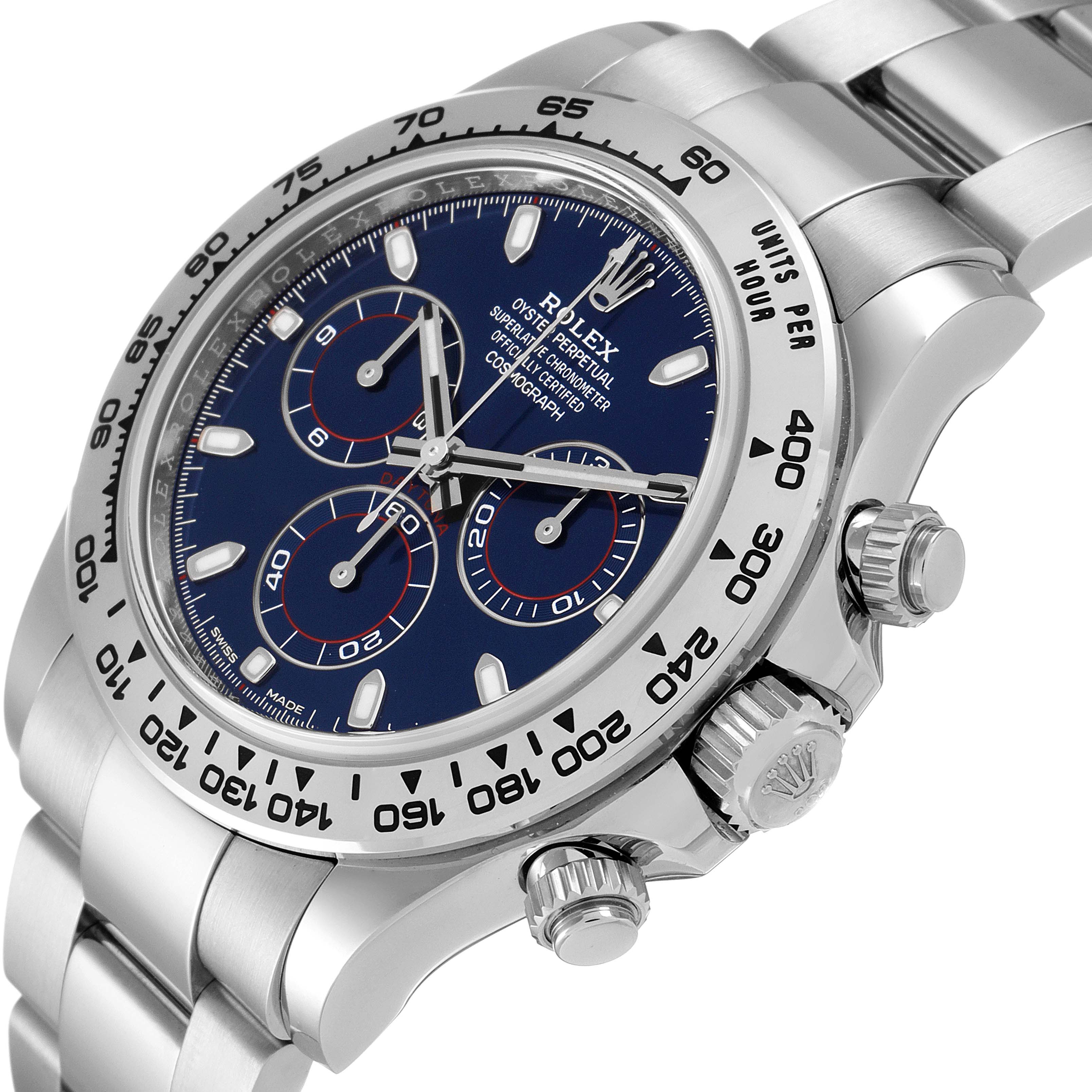 The image shows a close-up of the Rolex Daytona 116509 Men's White Gold Blue Dial 116509 Men's White Gold Blue Dial watch face, case, and part of the bracelet, angled slightly to the right. 