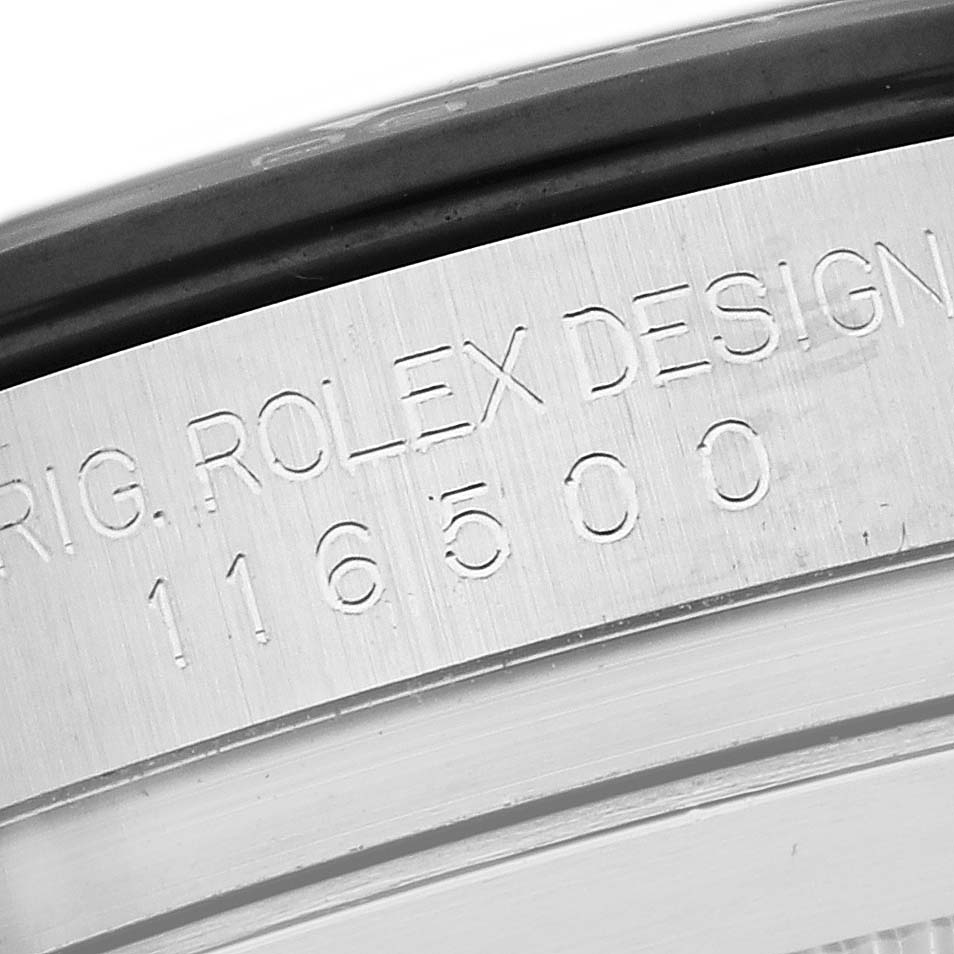 The image shows a close-up of the Rolex Daytona 116500LN Men's Stainless Steel White Dial 116500LN Men's Stainless Steel White Dial's metal bezel with engraved text and model number.