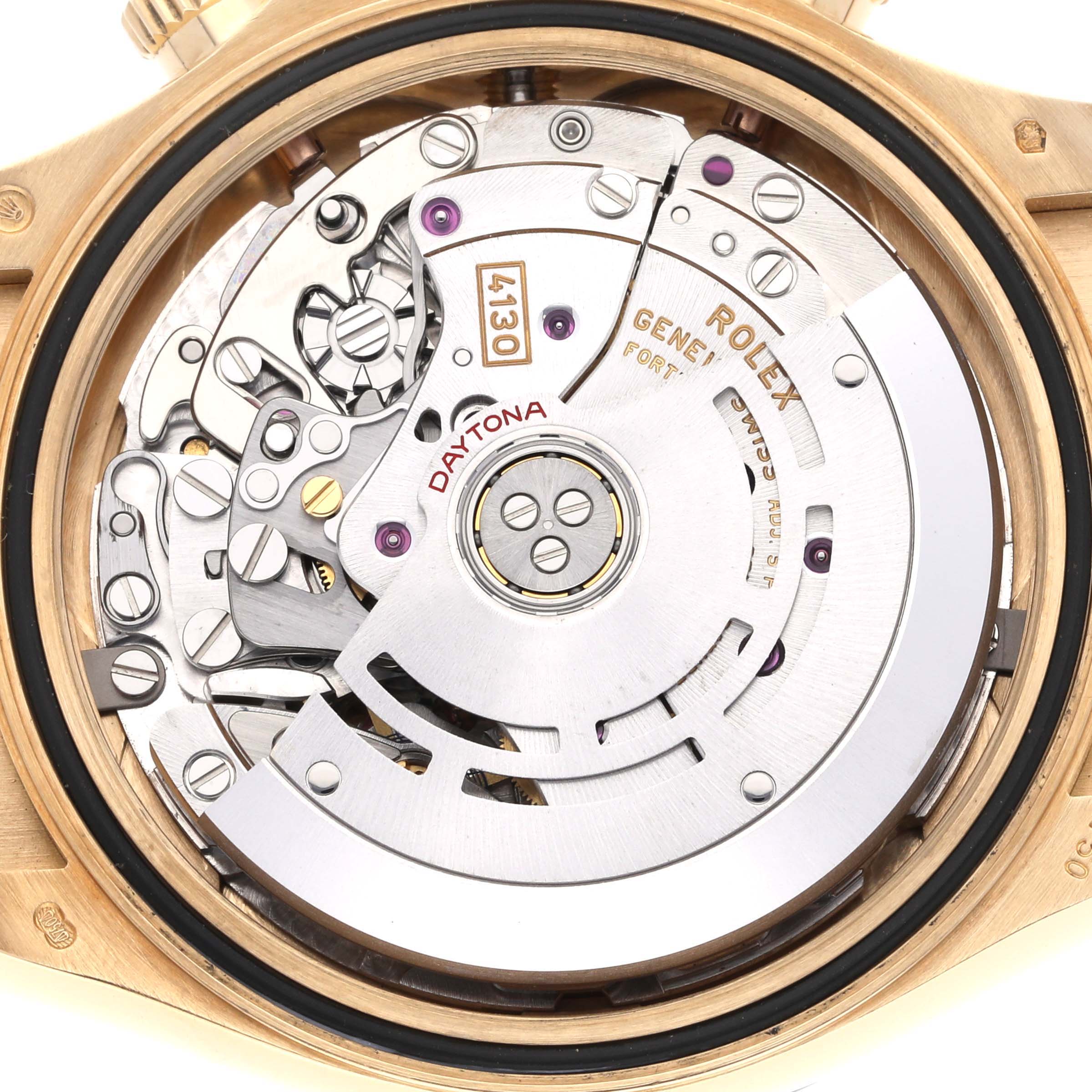 The image shows the rear view of a Rolex Daytona 116518 Men
s Yellow Gold Black Dial 116518 Men
s Yellow Gold Black Dial watch, highlighting its intricate movement and rotor mechanics.