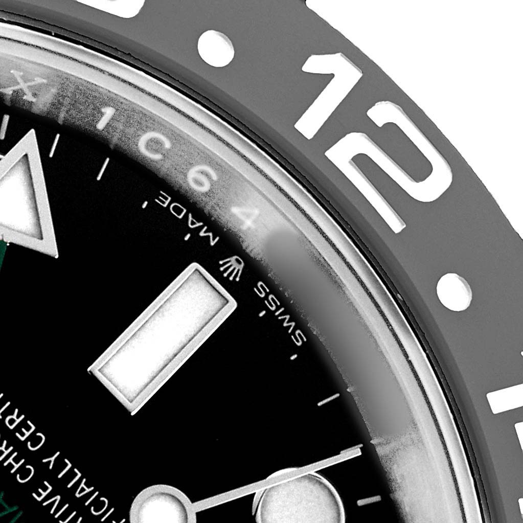 The image shows a close-up angle of the Rolex GMT-Master 126710 Men's Stainless Steel Black Dial's dial, focusing on indices, hands, and part of the bezel.